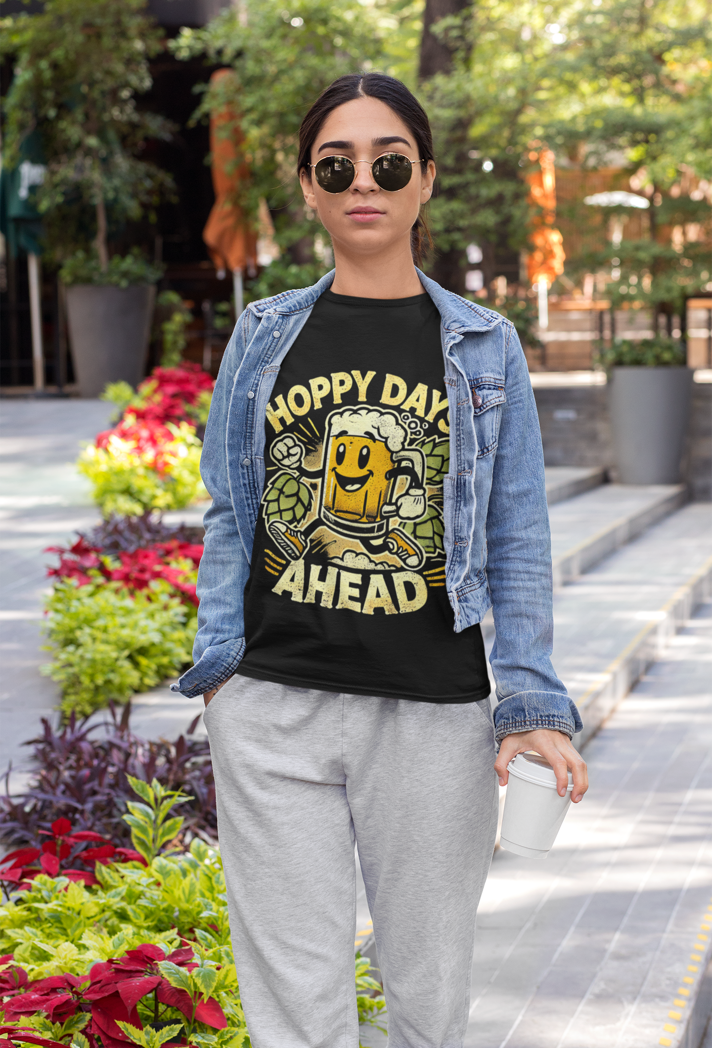 Woman wearing Printify funny beer lover hoppy days ahead t-shirt black graphic beer mug with denim jacket outdoors