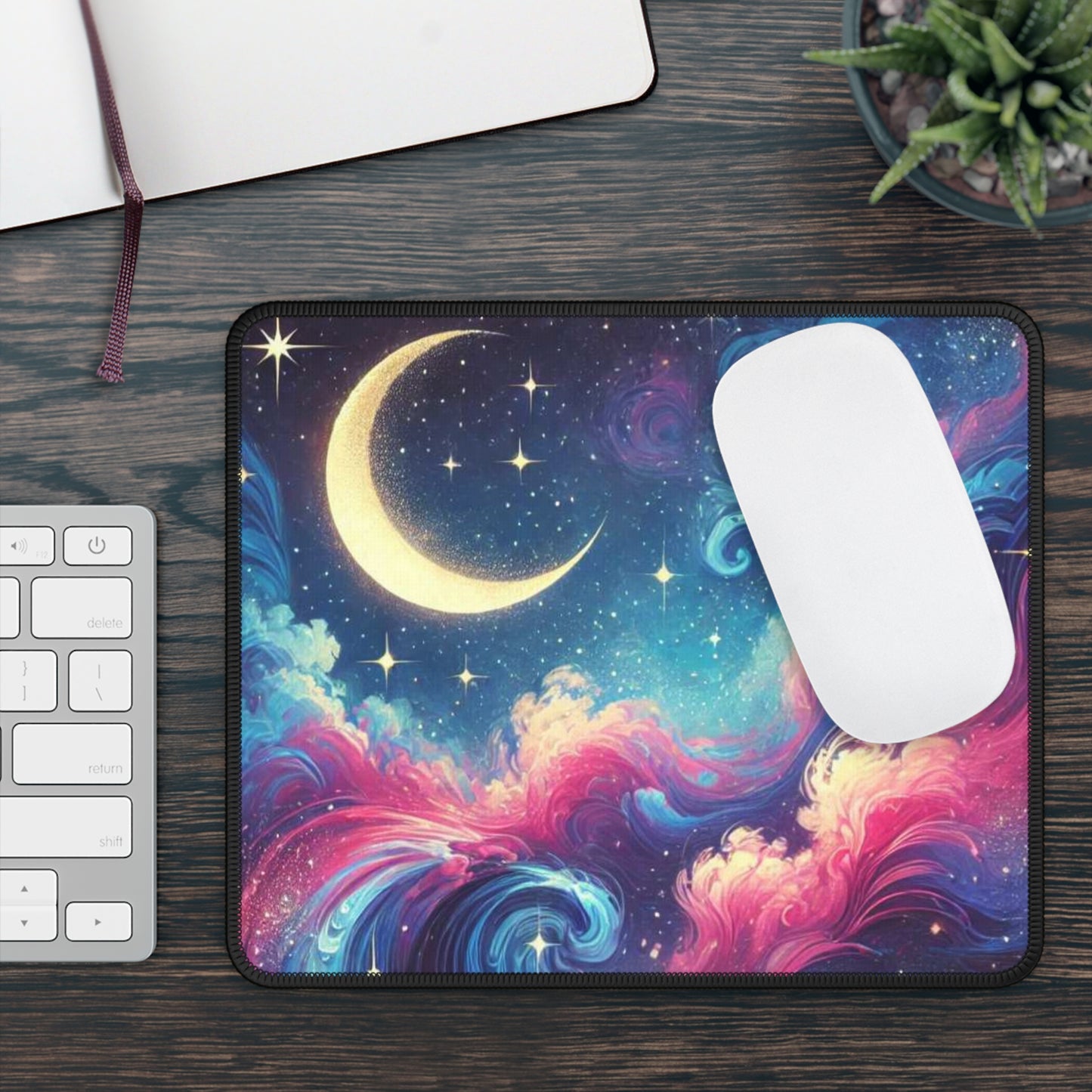 Moon dust gaming mouse pad with crescent moon and colorful cosmic design on wooden desk