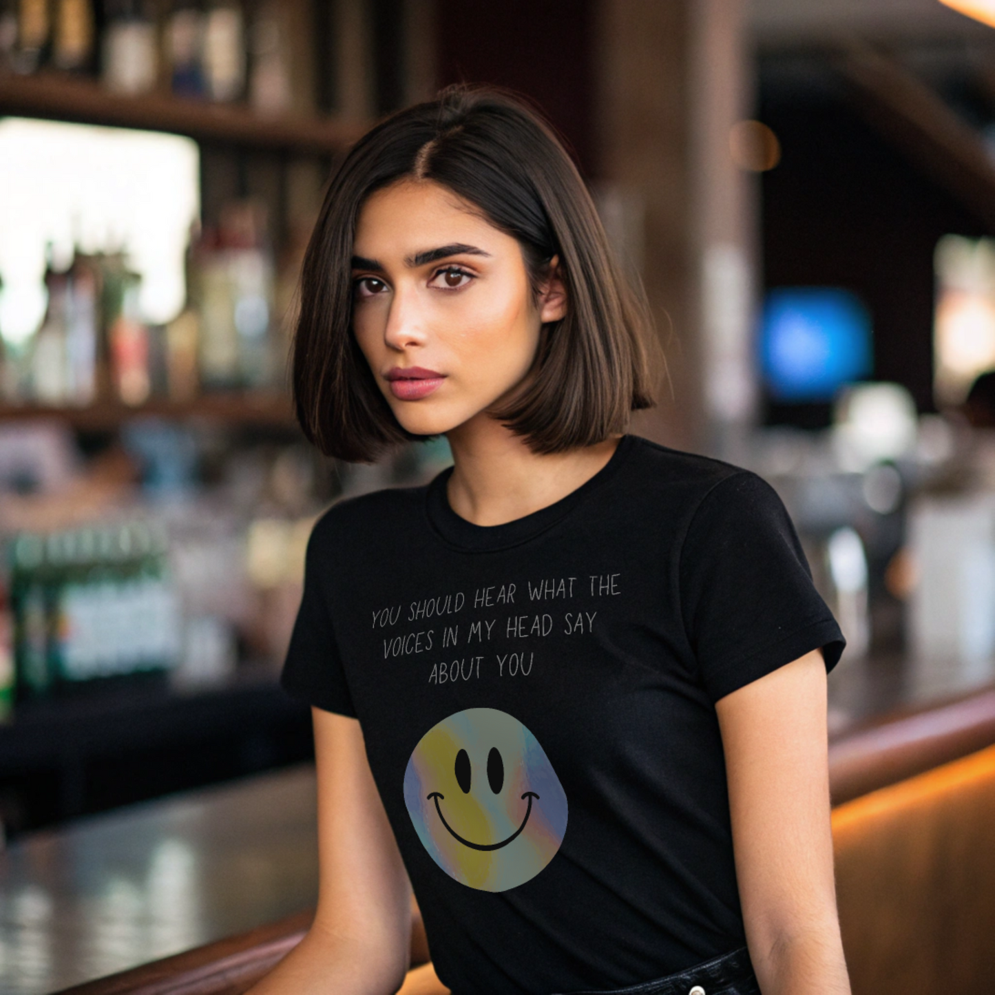 Voices in my head funny smiley face unisex shirt worn by a woman with a black background