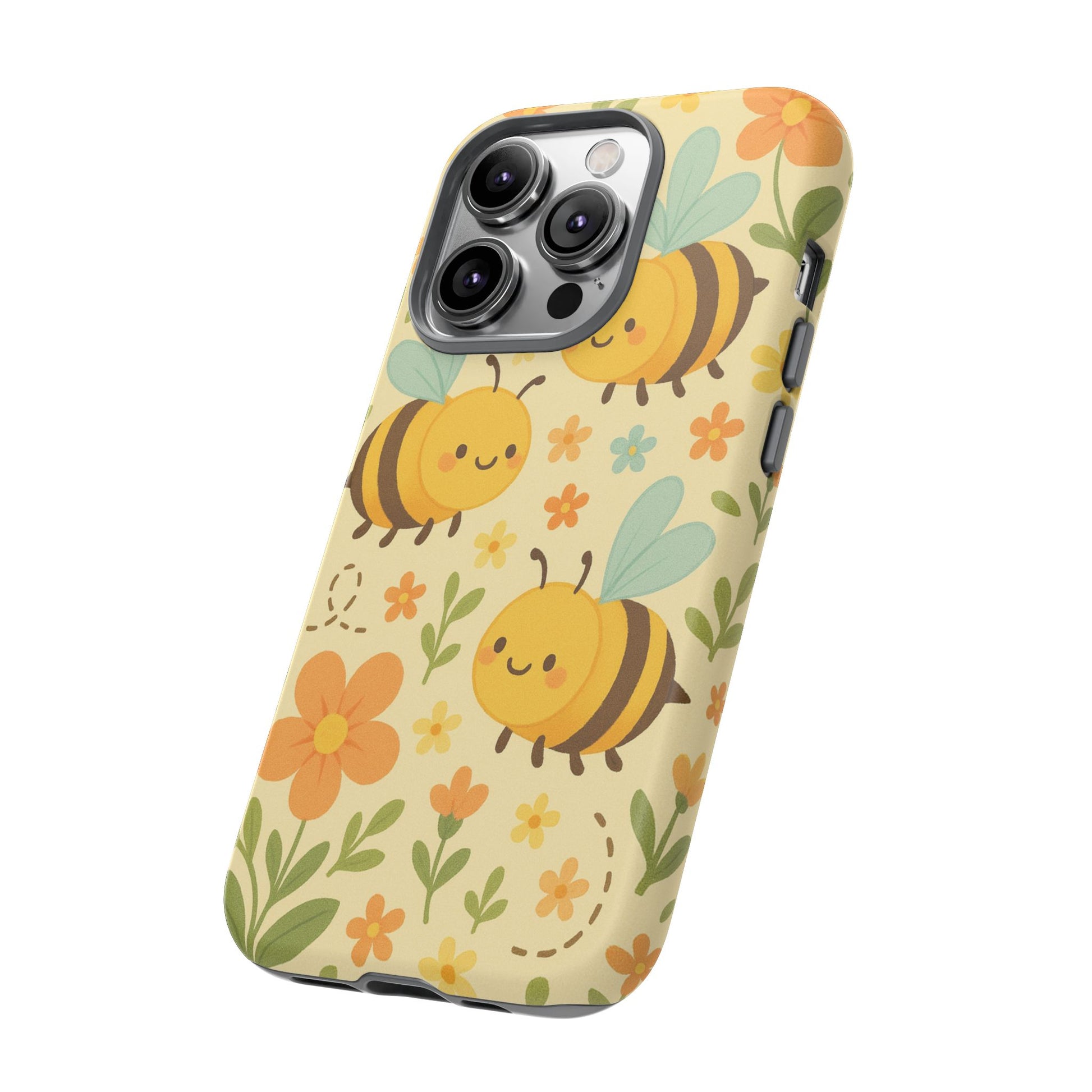 The Cute Cartoon Floral Bee Tough Phone Case by Printify features smiling bees, orange and yellow flowers, and green leaves on a light yellow background—perfect for bee lovers or as a durable phone case gift.