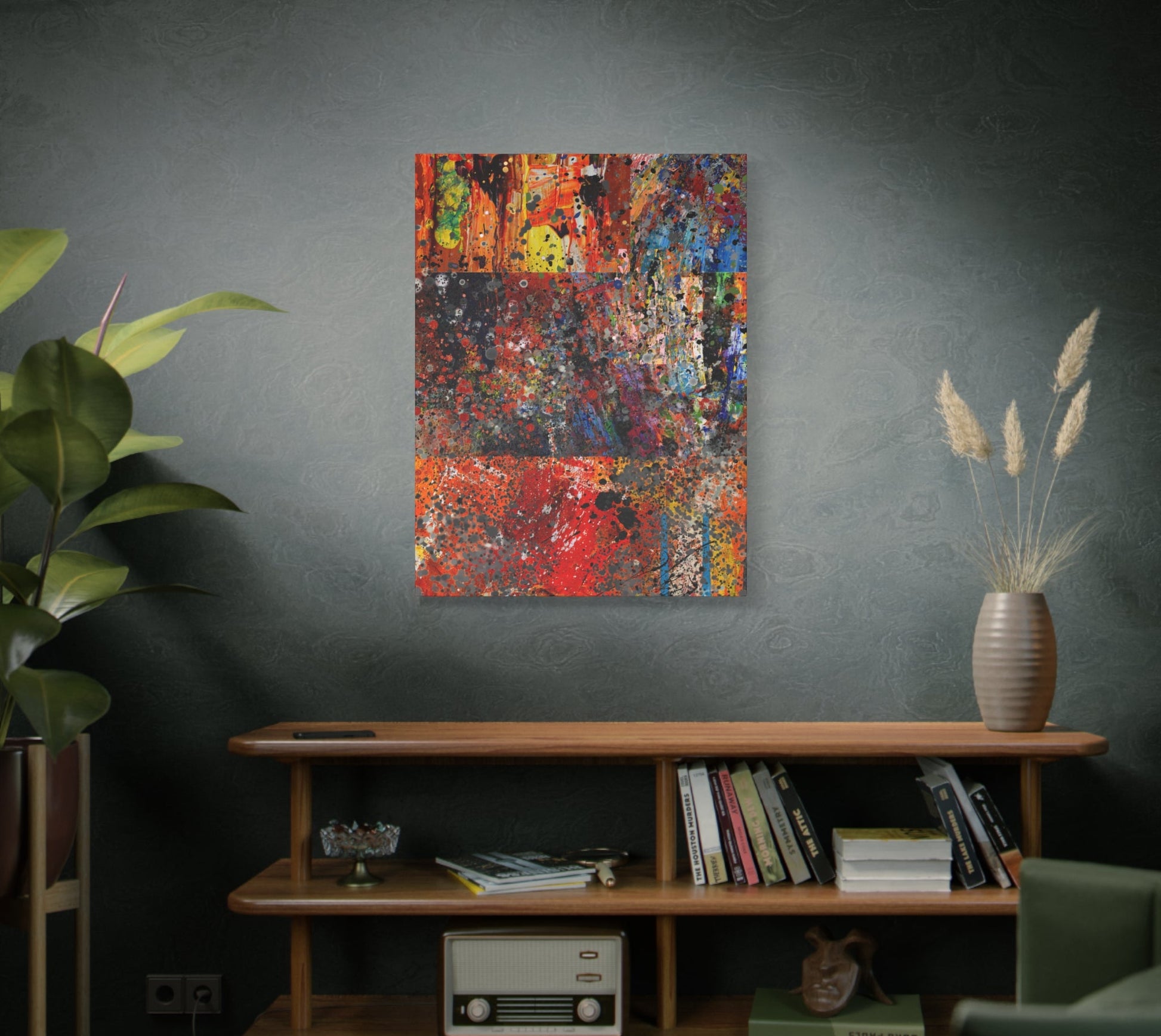 Abstract painting on a wall above a wooden shelf with books and decor.