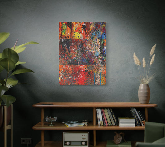 Abstract painting on a wall above a wooden shelf with books and decor.