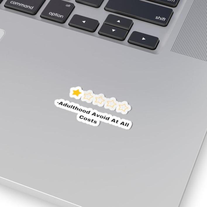 Printify adulthood review sticker with one gold star and four empty stars on a silver laptop surface