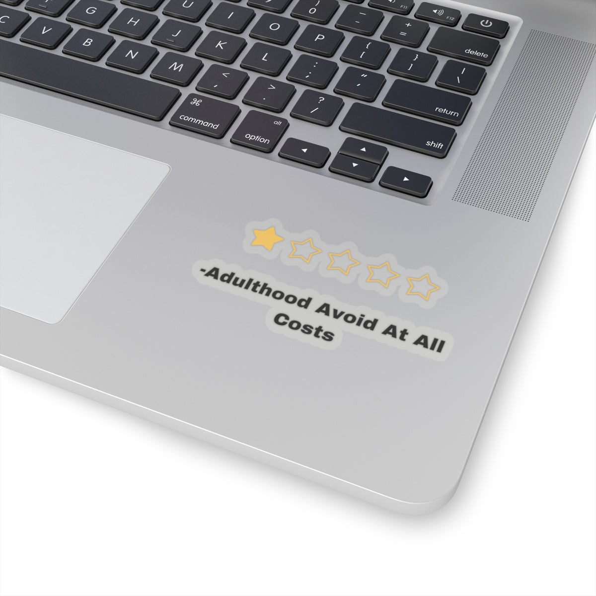 Adulthood review sticker with one star and avoid at all costs text on laptop keyboard area