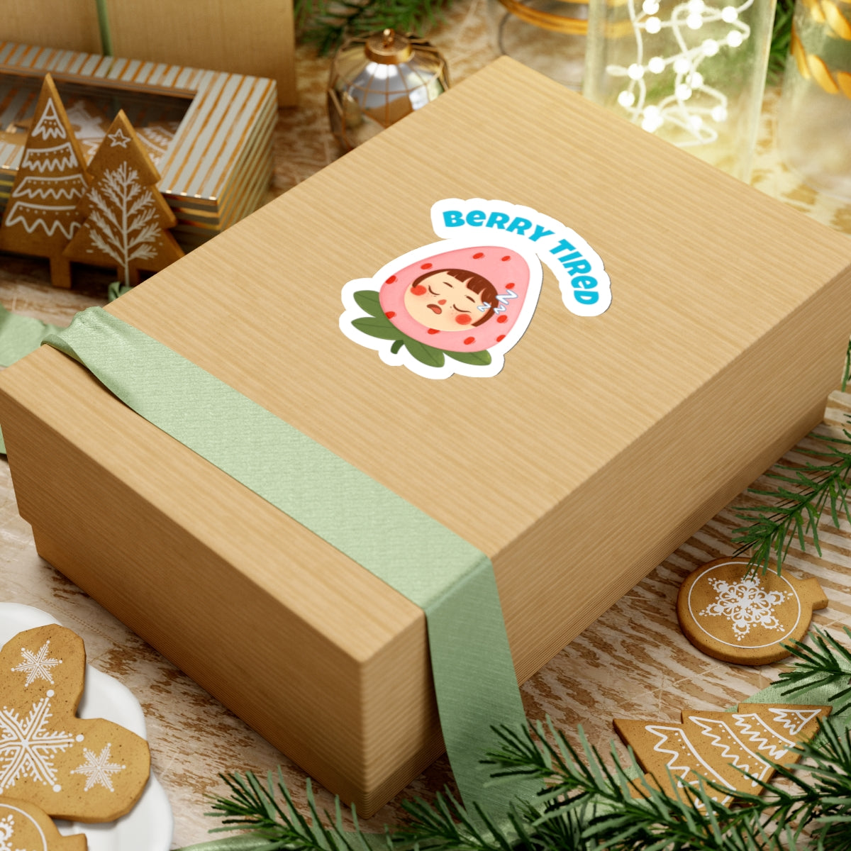 Berry tired vinyl sticker on a brown gift box with green ribbon and holiday decorations