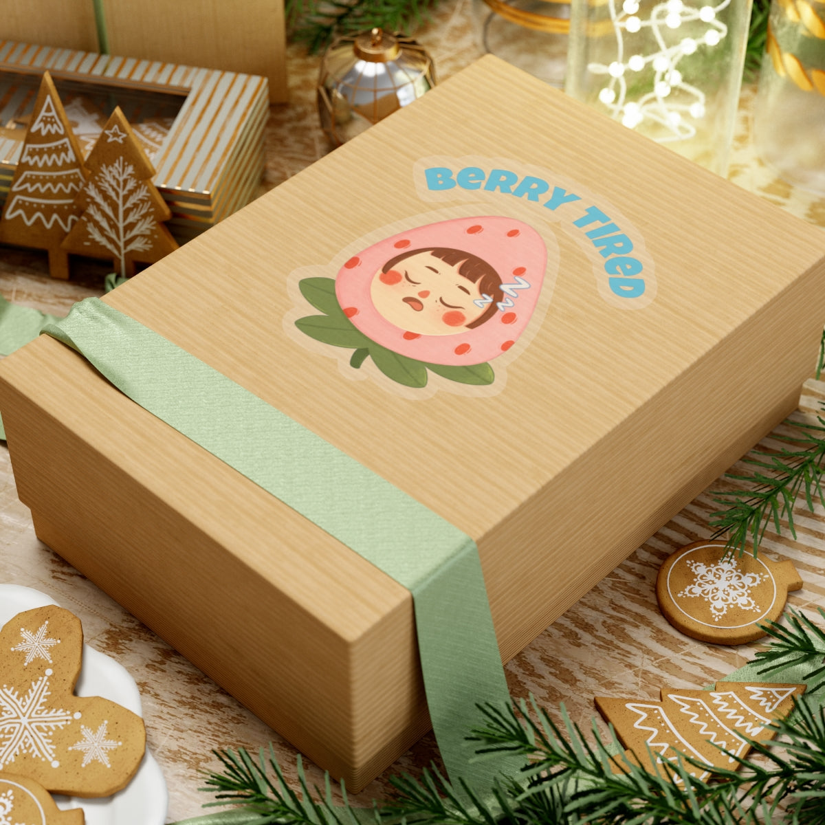 Printify berry tired vinyl sticker on a brown gift box with green ribbon surrounded by holiday decor