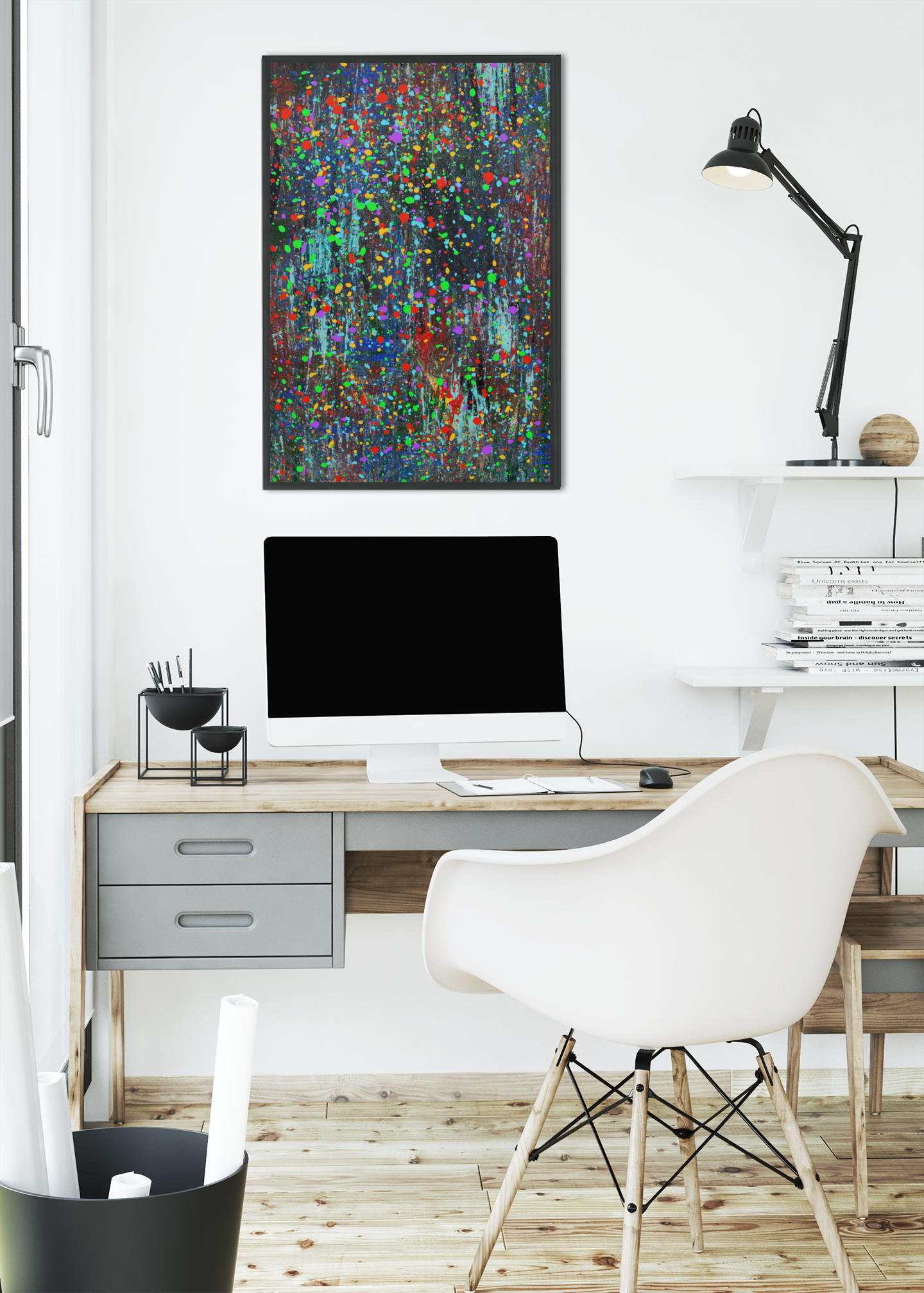 Color drip explosion art canvas print hanging above a modern white desk setup in a bright home office