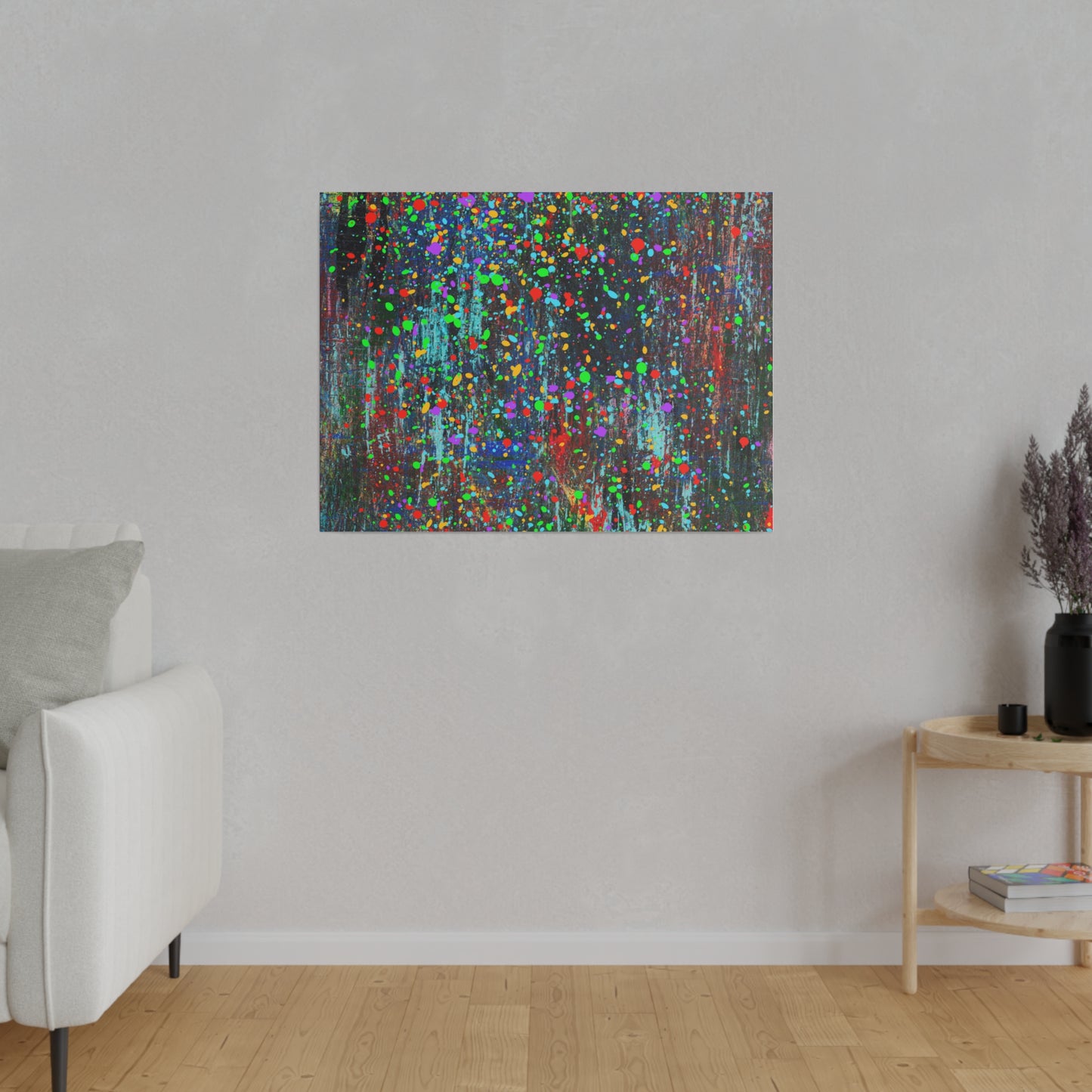 Color drip explosion art canvas print hanging on wall in modern living room with light furniture