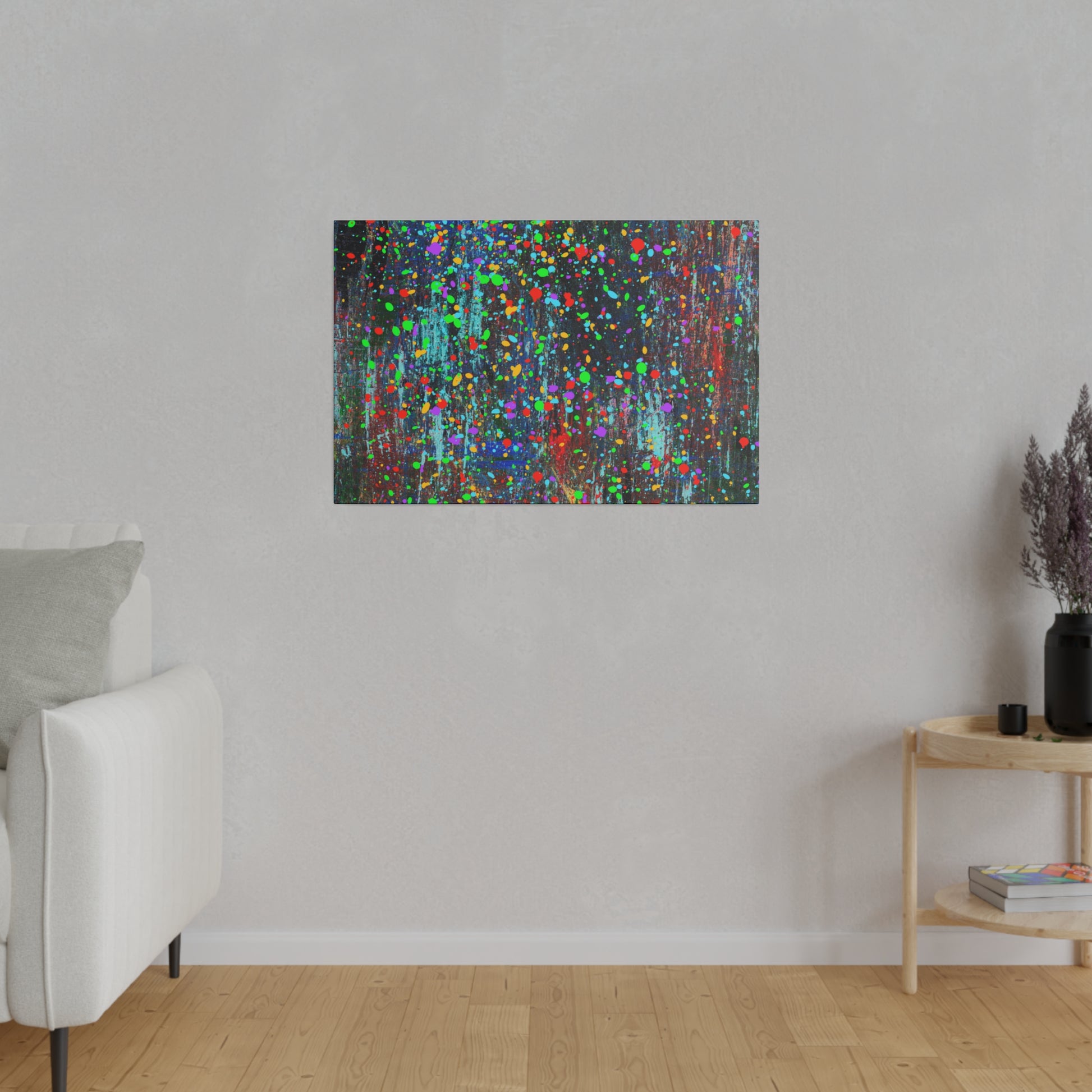 Color drip explosion art canvas print by Printify hanging on a gray wall in modern living room