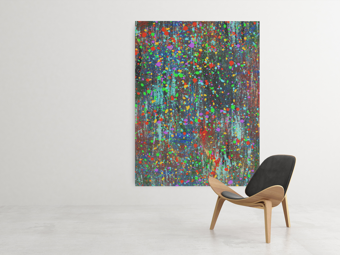 Color drip explosion art canvas print hanging on white wall next to modern wooden chair