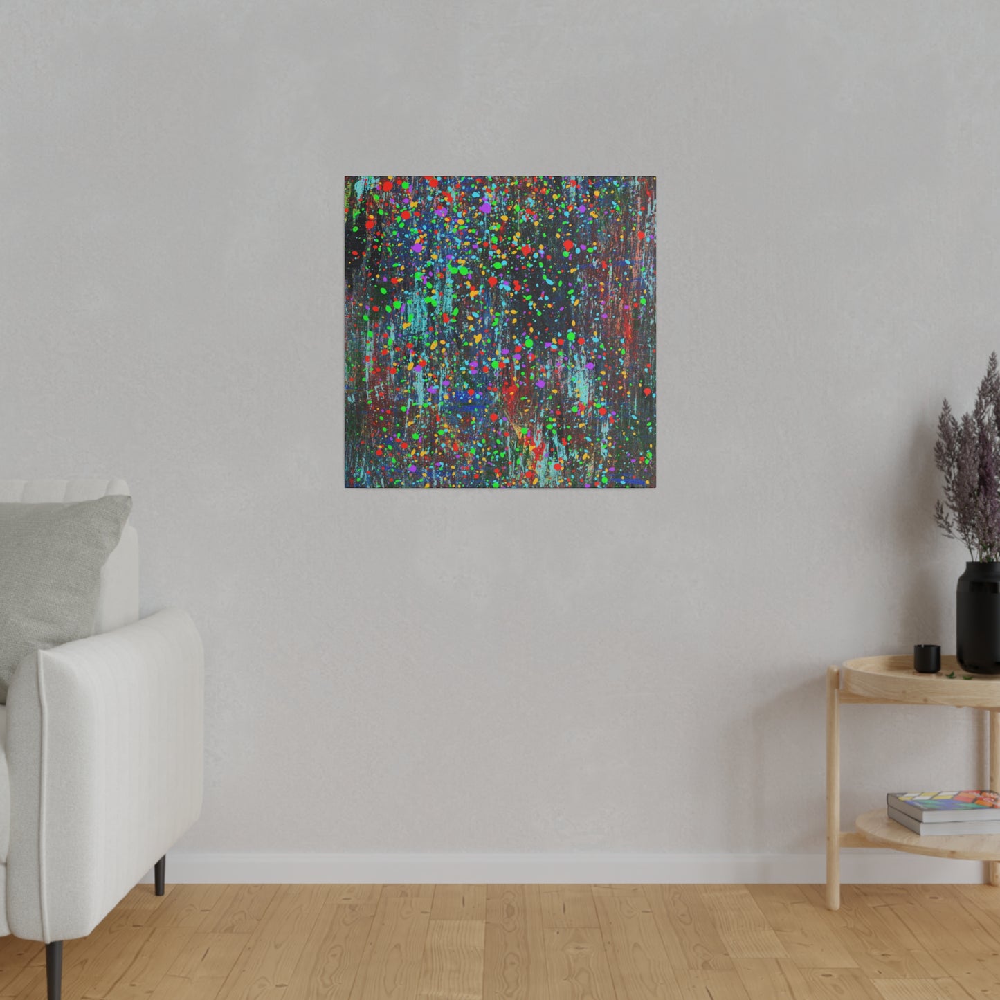 Color drip explosion art canvas print by Printify hanging on wall in modern living room