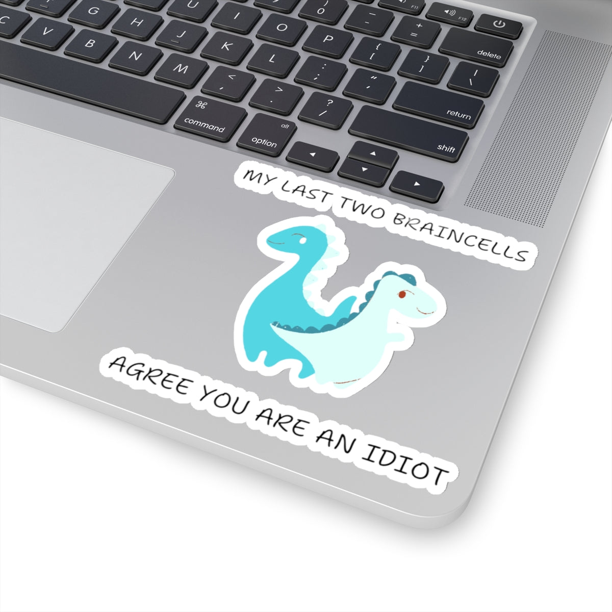 Cute dinosaur meme stickers with funny text on laptop keyboard area from Printify