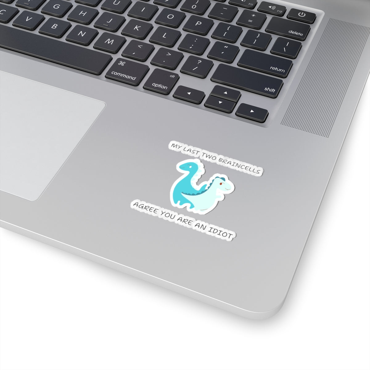 Cute dinosaur meme stickers featuring a blue dinosaur with funny text on a silver laptop