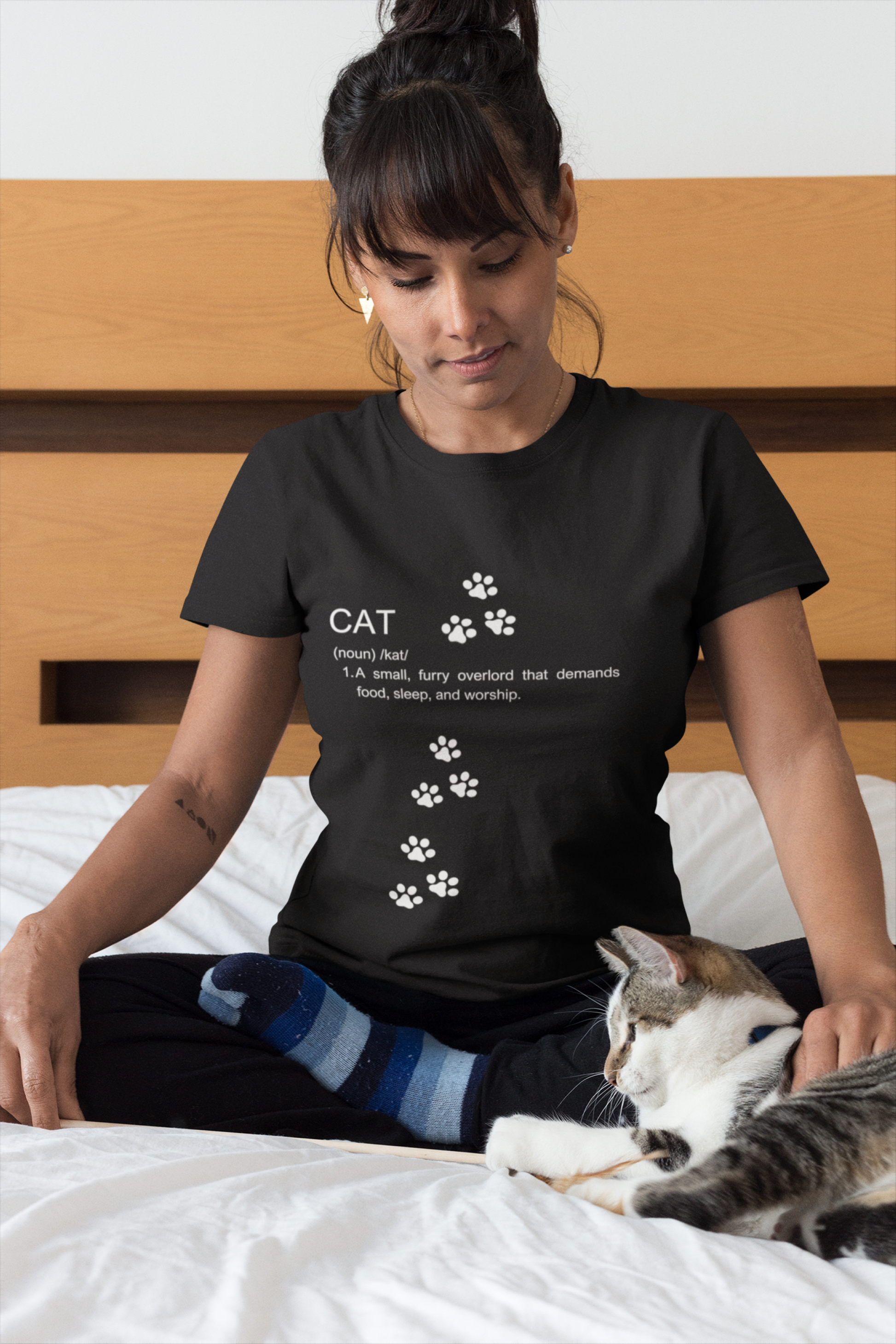 Funny cat definition t-shirt featuring playful paw print design on a black background