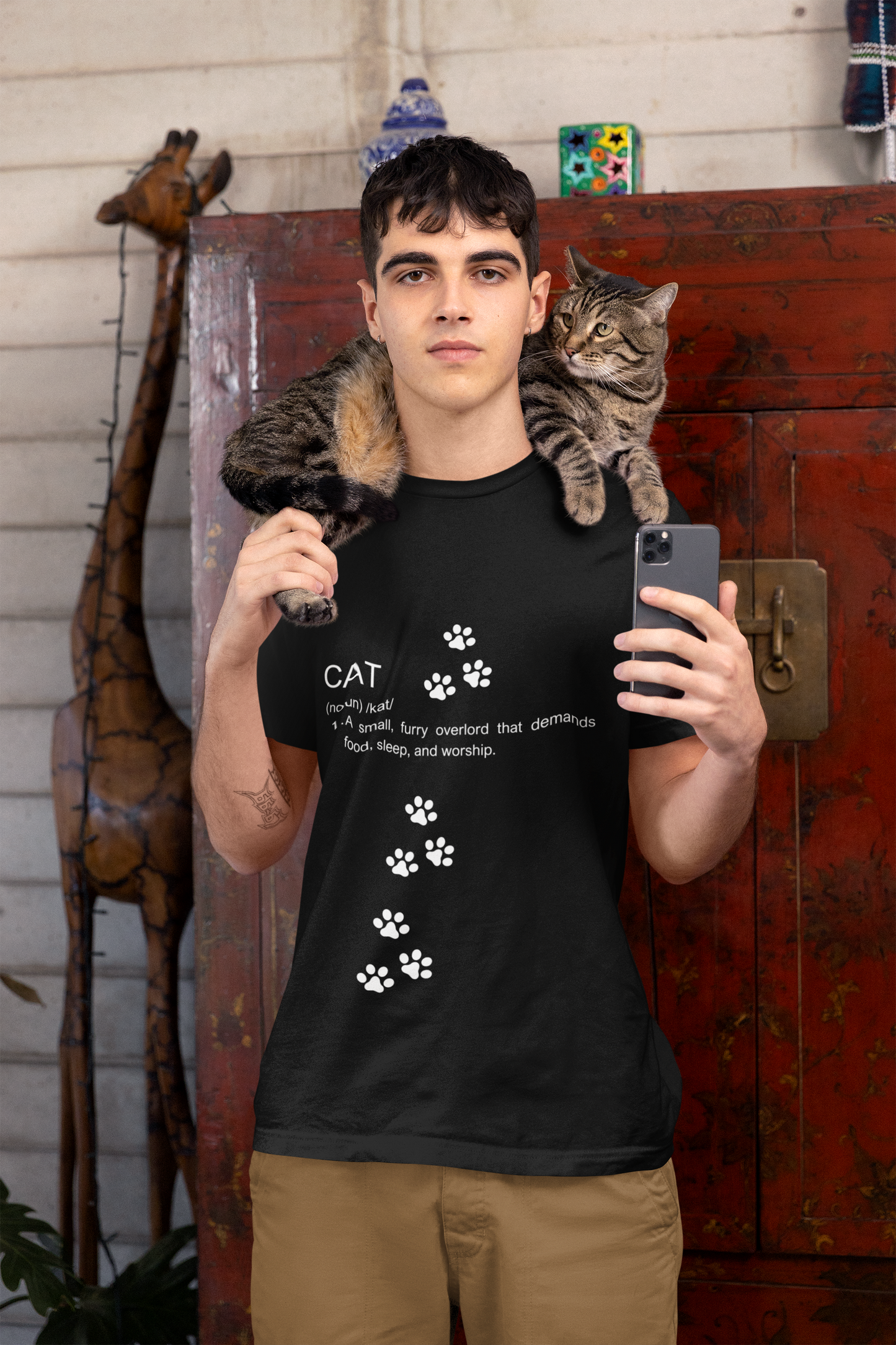 Funny cat definition t-shirt featuring a humorous text design with paw prints