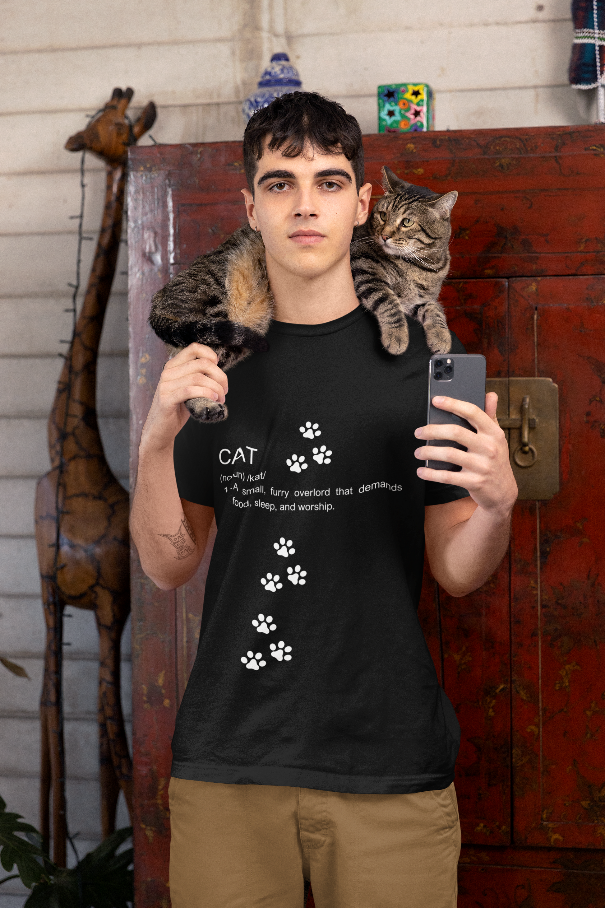 Funny cat definition t-shirt featuring a humorous text design with paw prints