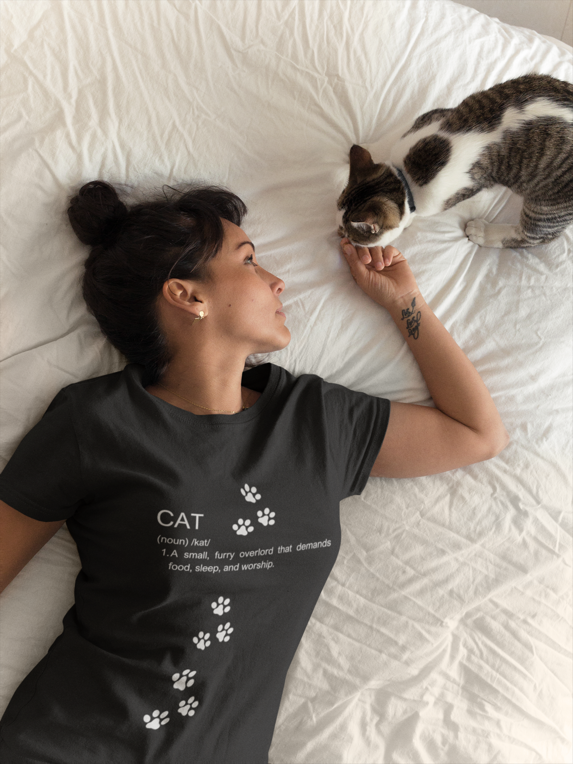 Funny cat definition t-shirt featuring a humorous description of cats with paw print design