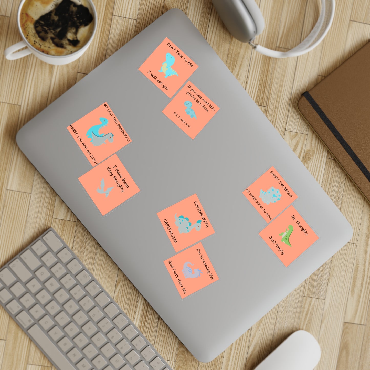 Funny edgy sarcastic cute dino sticker bundle on a laptop with a coffee cup