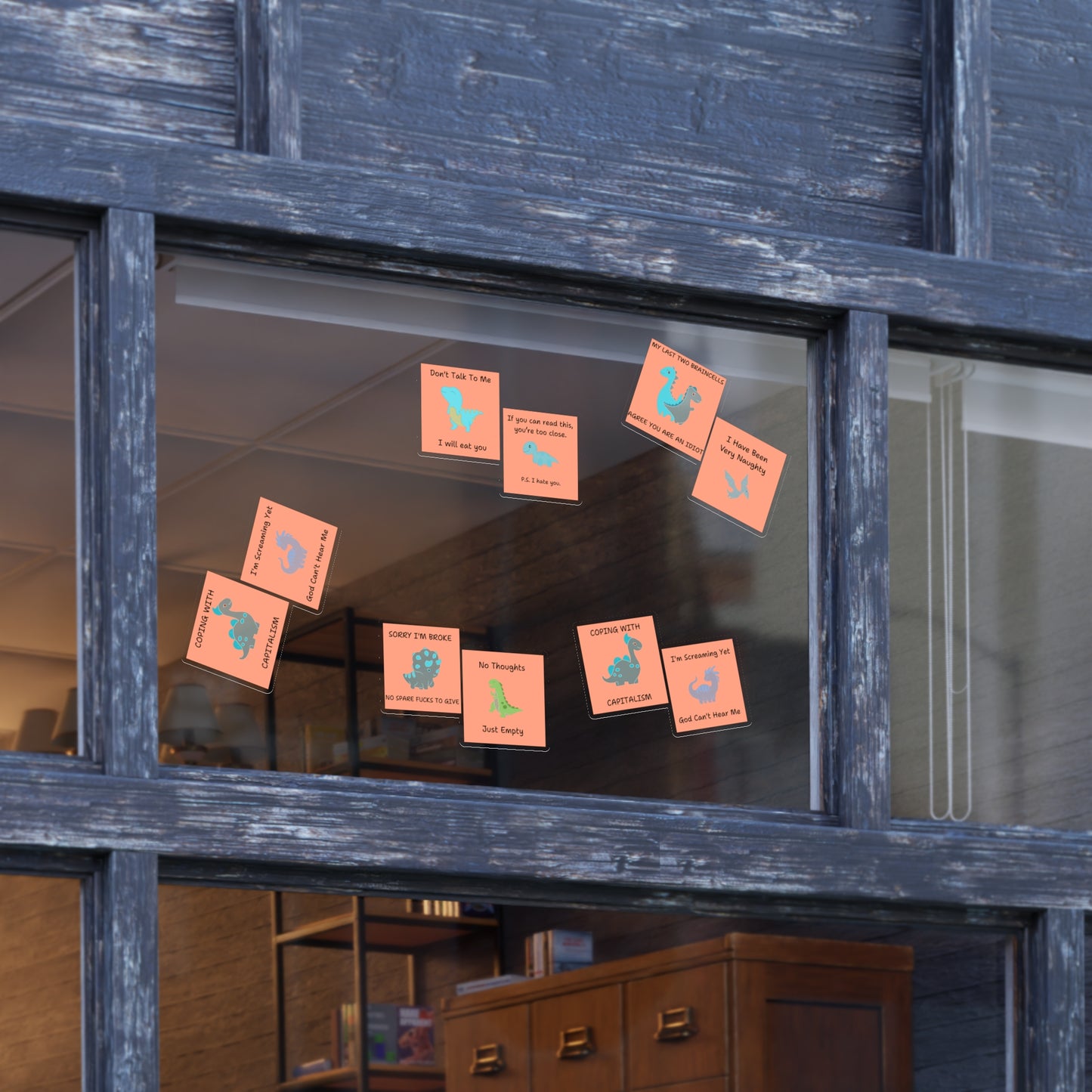 Funny edgy sarcastic cute dino sticker bundle displayed on a window in bright colors