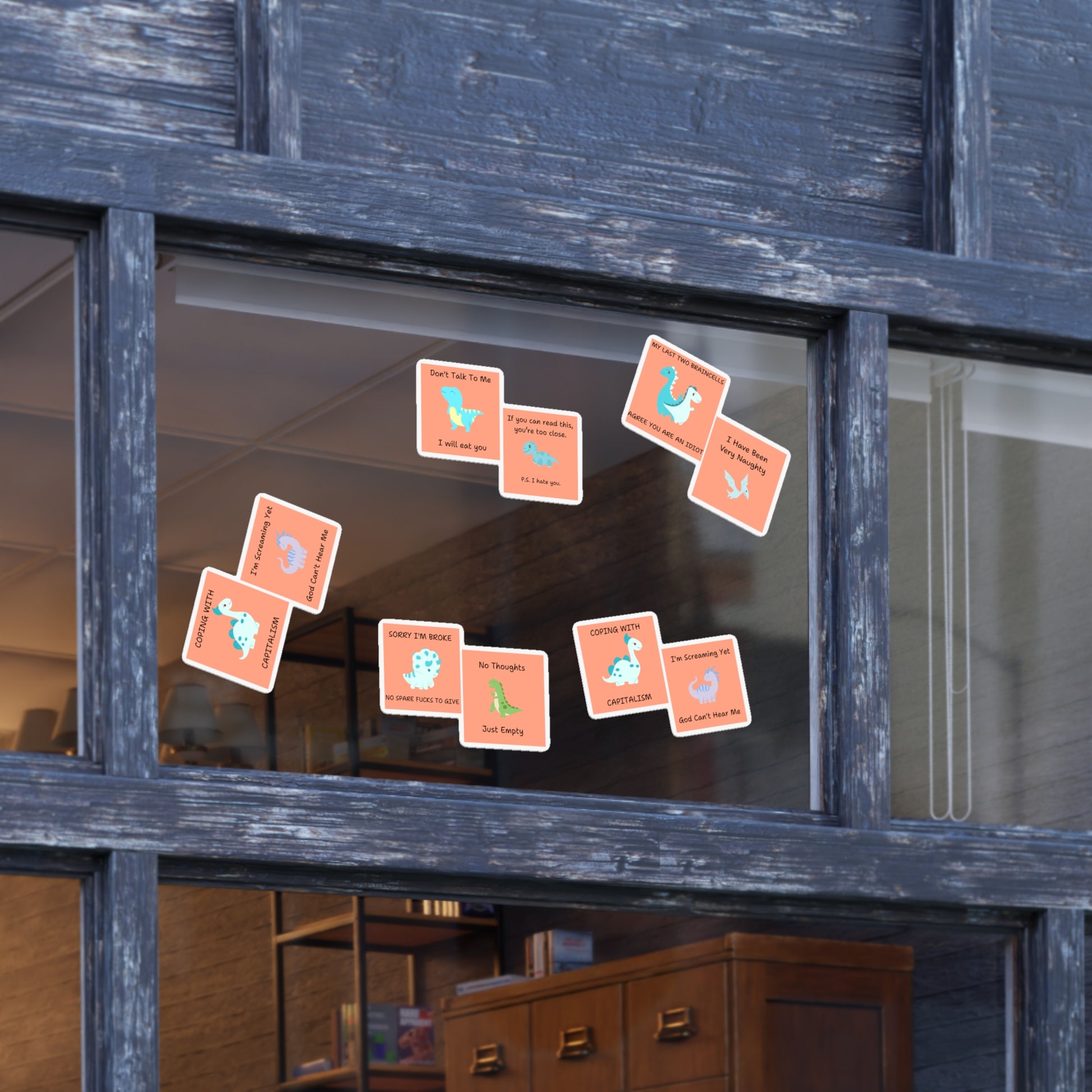Funny edgy sarcastic cute dino sticker bundle displayed on a window for fun decoration