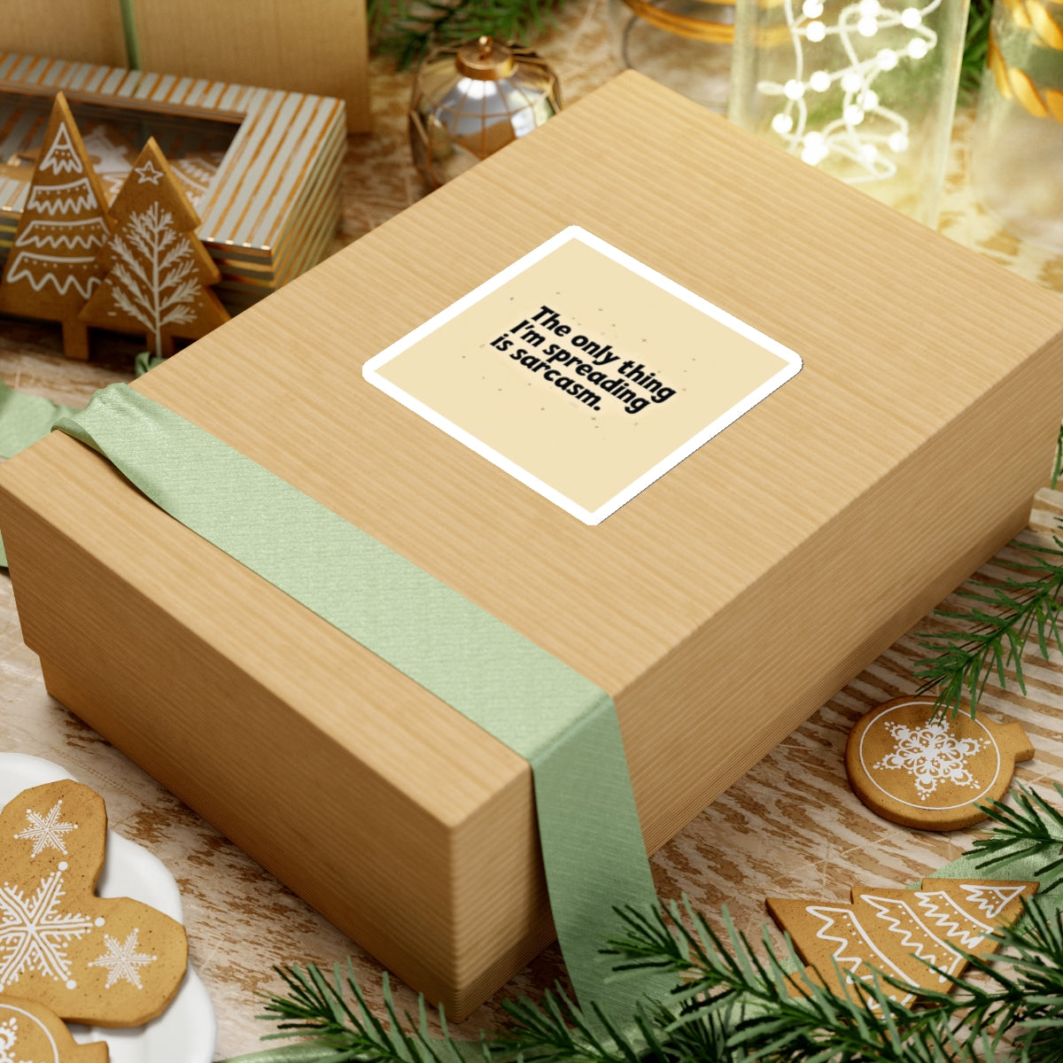 Printify funny sarcasm stickers on a brown gift box with holiday decorations and gingerbread cookies