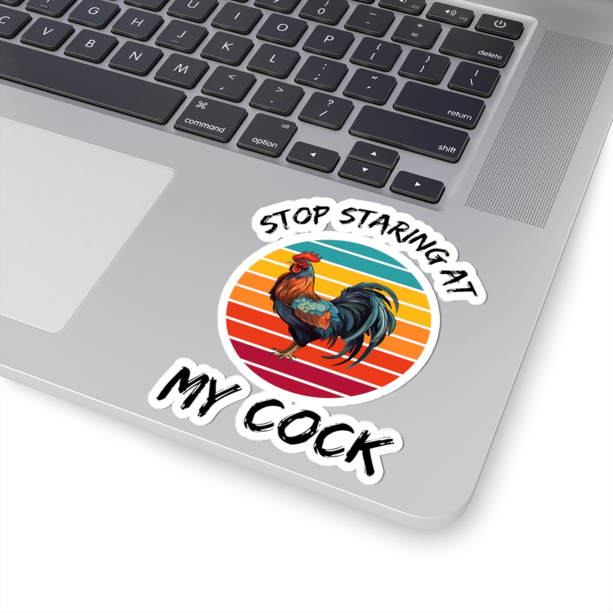 Printify paper sticker on laptop featuring rooster and retro sunset reading stop staring at my cock adult meme sticker