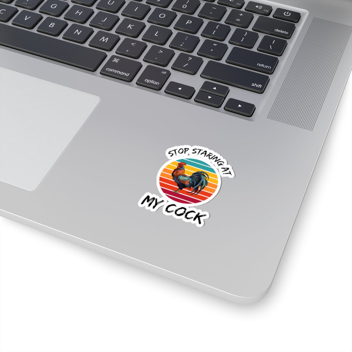 stop staring at my cock adult meme sticker on silver laptop featuring a rooster and retro sunset design by Printify