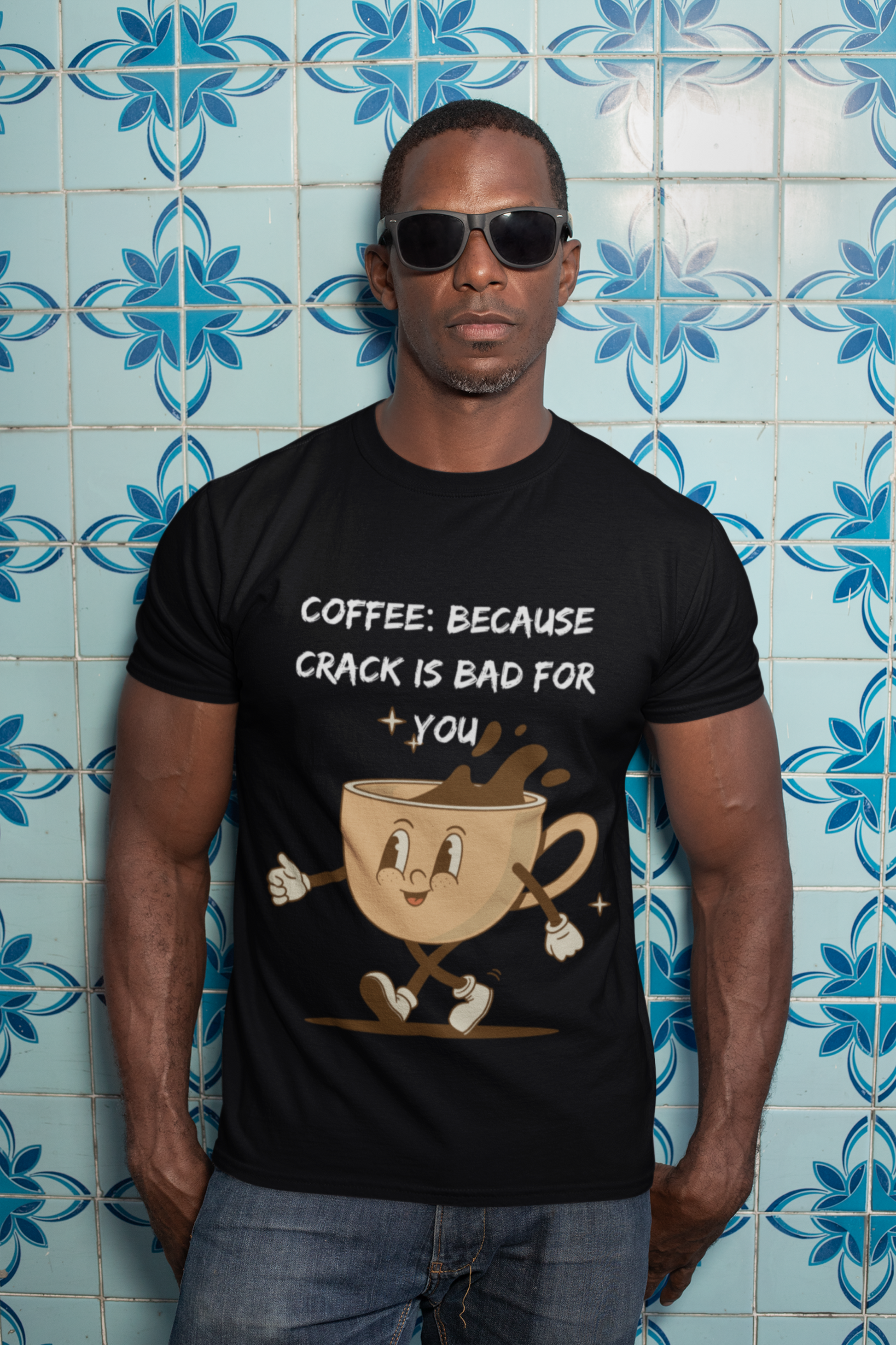 Man wearing Printify black t shirt with cartoon coffee cup design and text coffee because crack is bad for you shirt