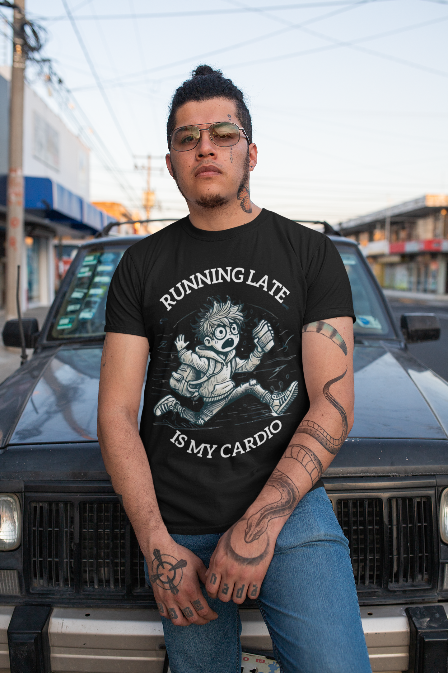 Printify funny running late t-shirt worn by tattooed model leaning on vintage car in urban street