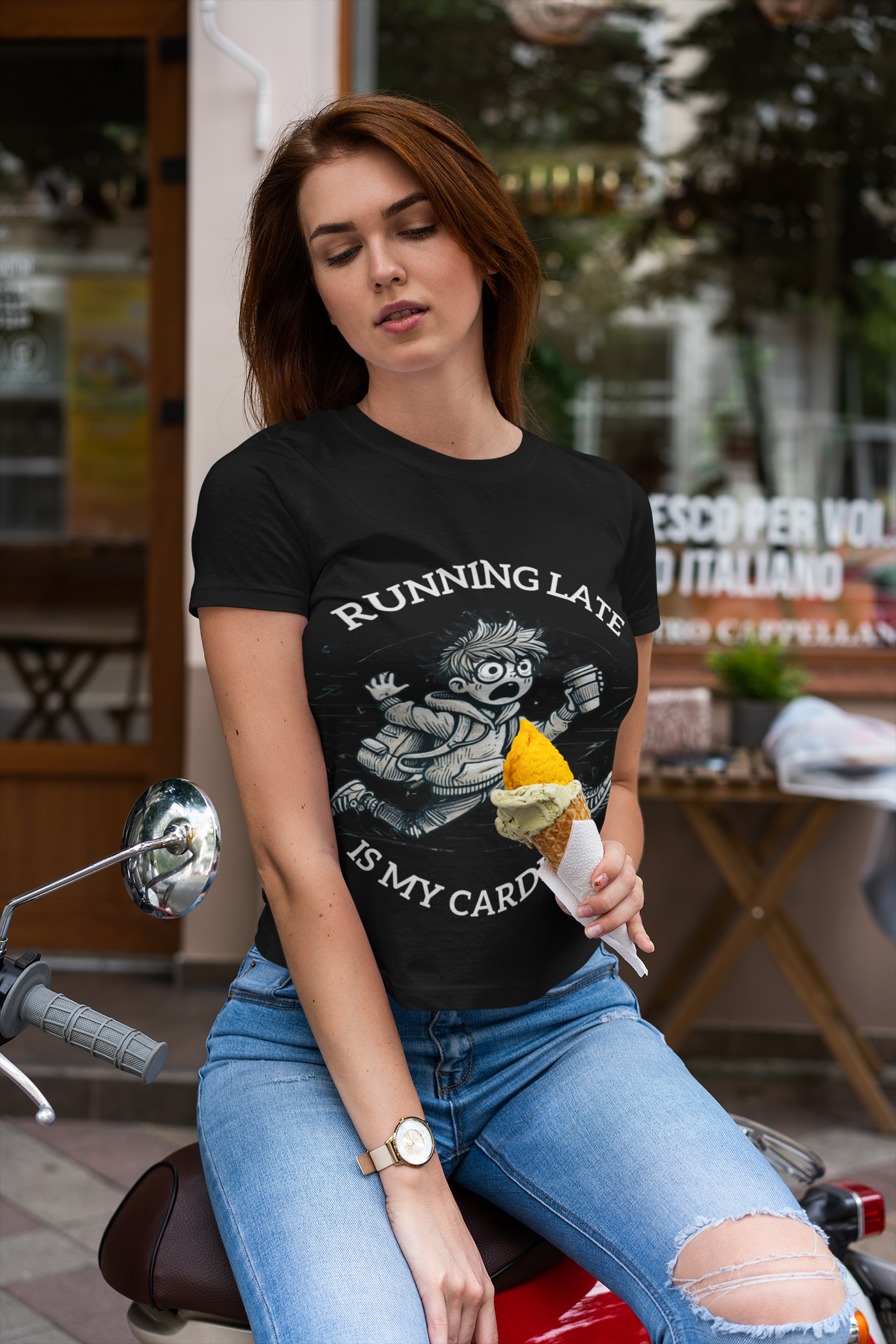 Printify black funny running late t-shirt with cartoon running graphic worn by woman on scooter holding ice cream at cafe