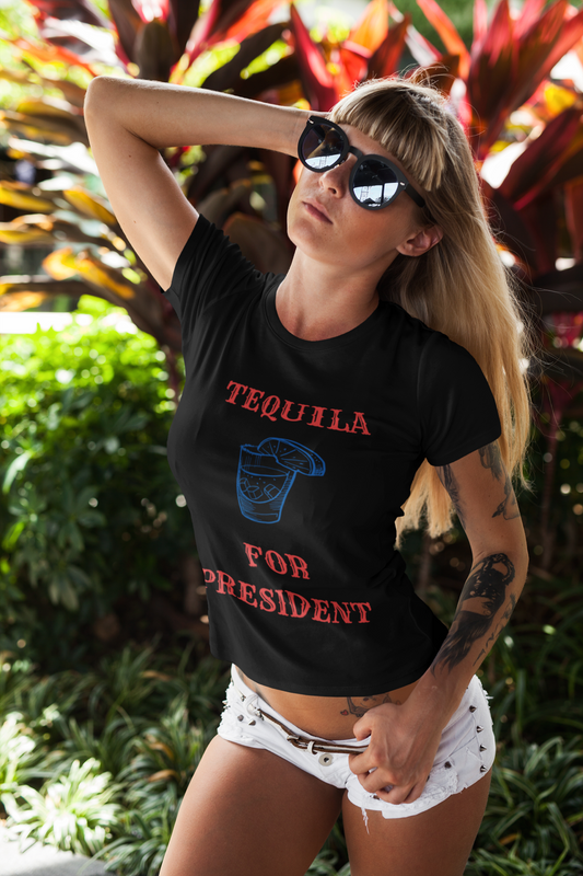 Woman in sunglasses wearing black tequila for president political humor  t-shirt with cocktail graphic outdoors