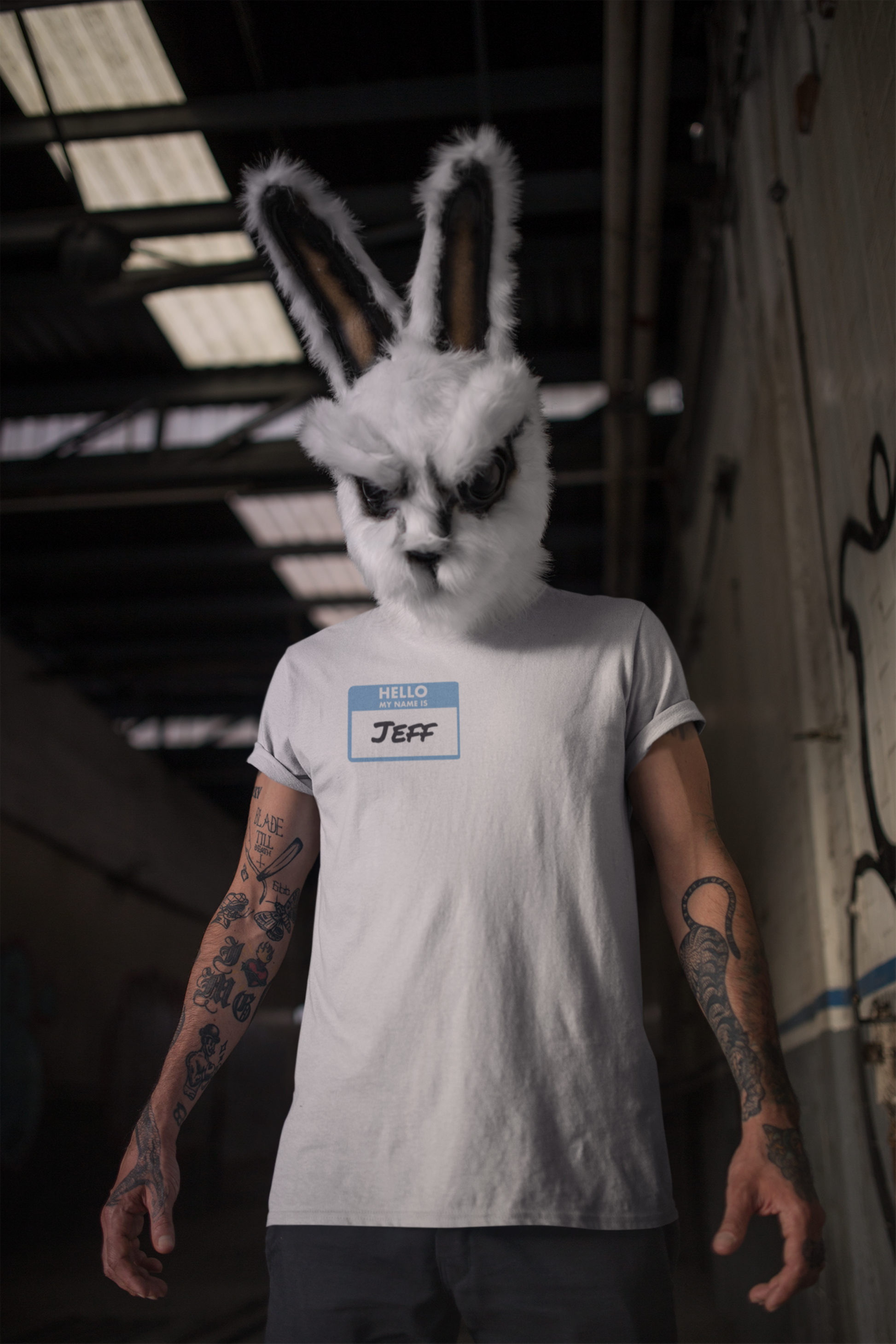 Printify my name is Jeff unisex funny shirt with white name tag worn by person in rabbit mask