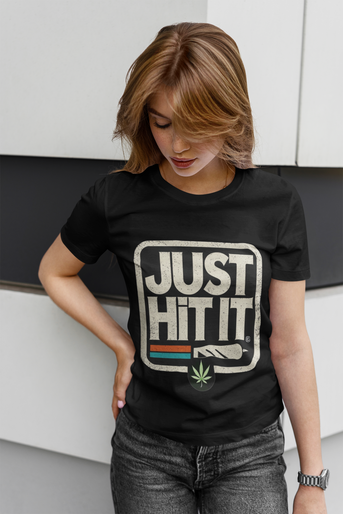 Model wearing Printify black funny weed just do it meme  t-shirt with JUST HIT IT joint graphic and cannabis leaf