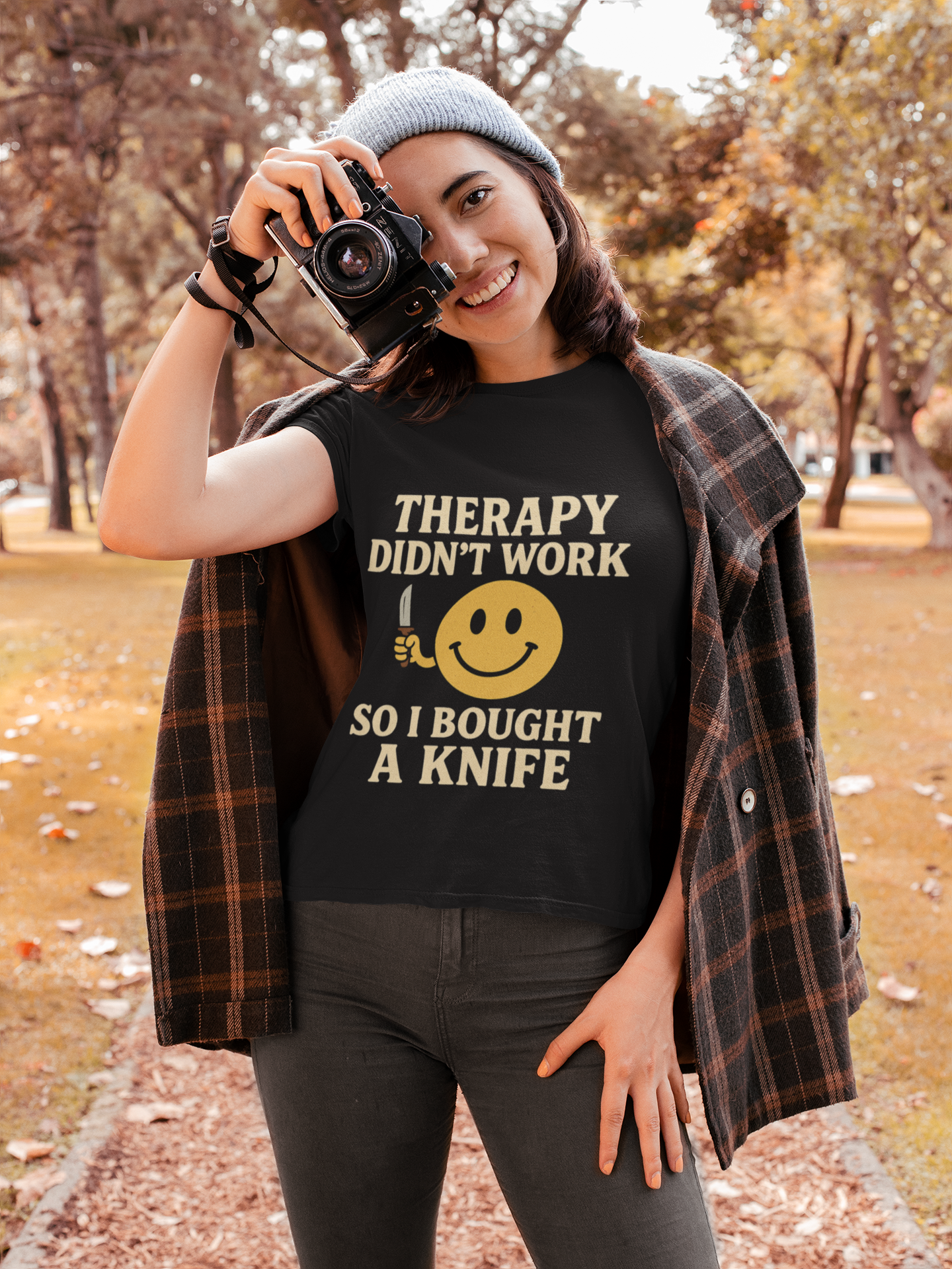 Woman outdoors wearing black tee with bold Therapy didnt work so I bought a knife print therapy dark joke humor unisex  t shirt .