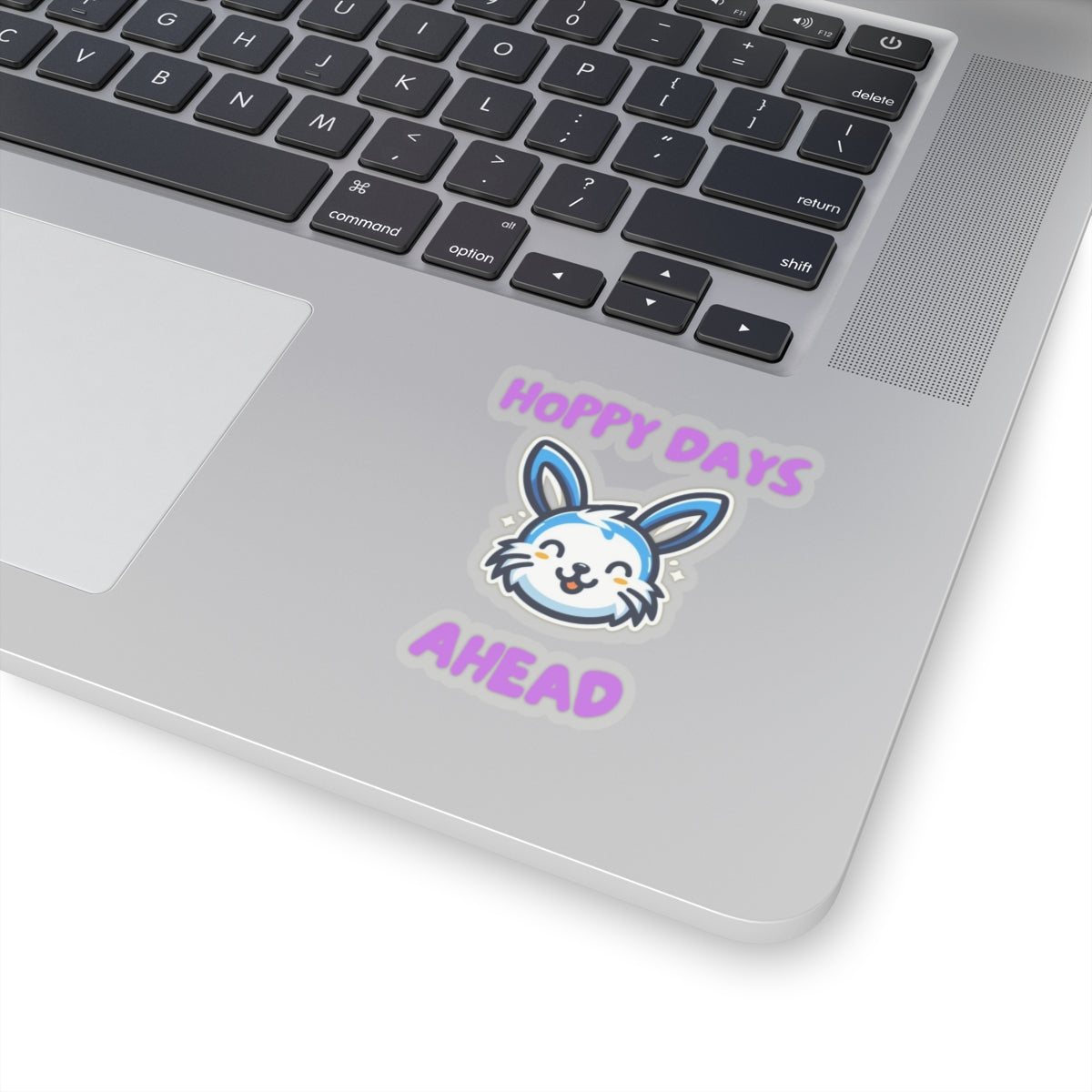 Hoppy days cute bunny sticker on laptop with smiling blue and white bunny and purple text