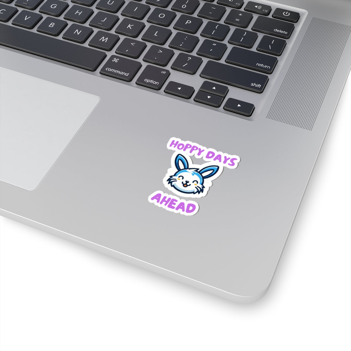 Printify hoppy days cute bunny sticker on a silver laptop keyboard palm rest area