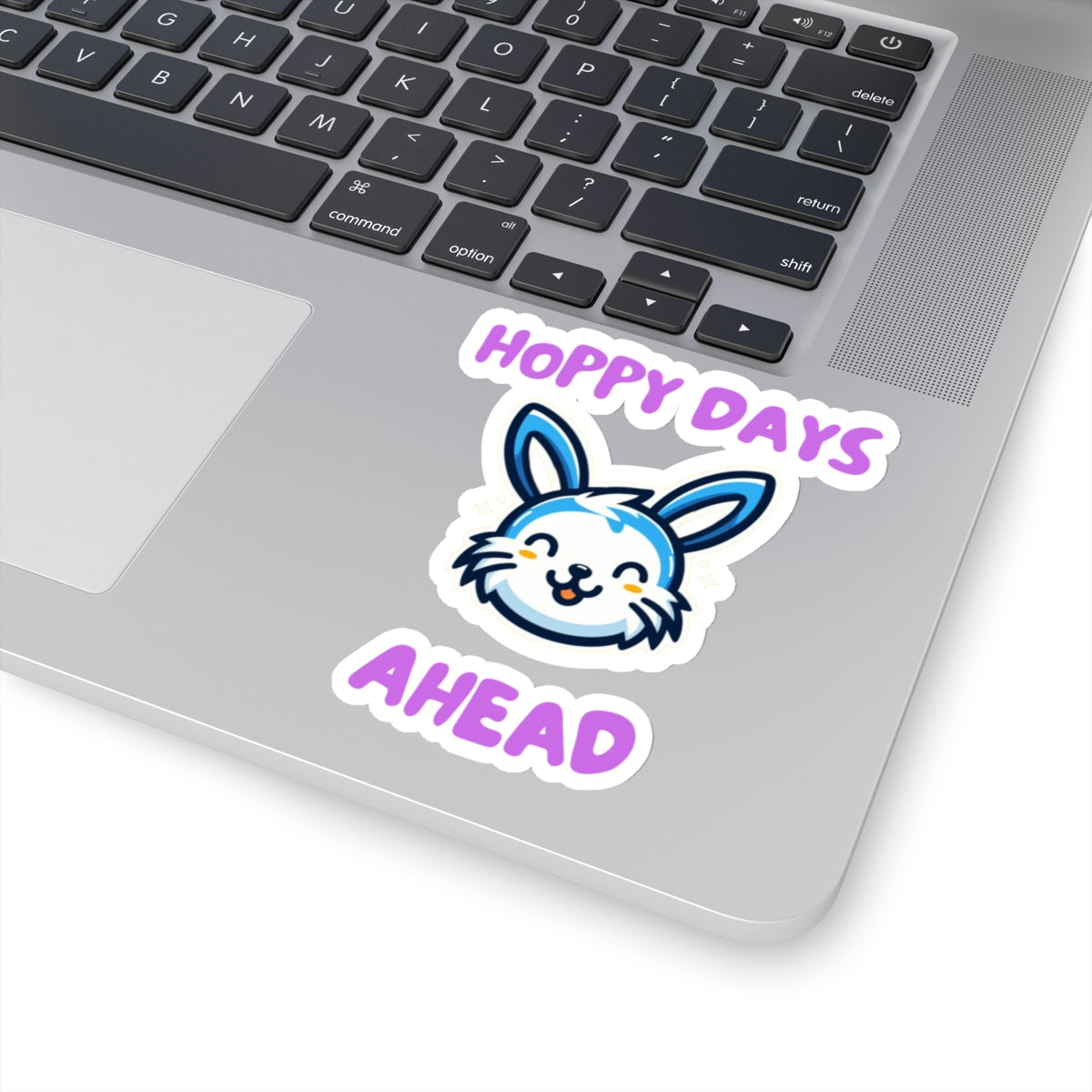 Printify hoppy days cute bunny sticker on silver laptop keyboard with purple text and smiling bunny face