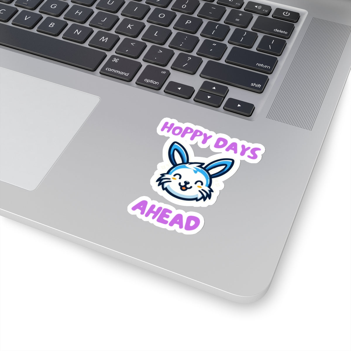 Hoppy days cute bunny sticker on silver laptop keyboard printed by Printify paper products