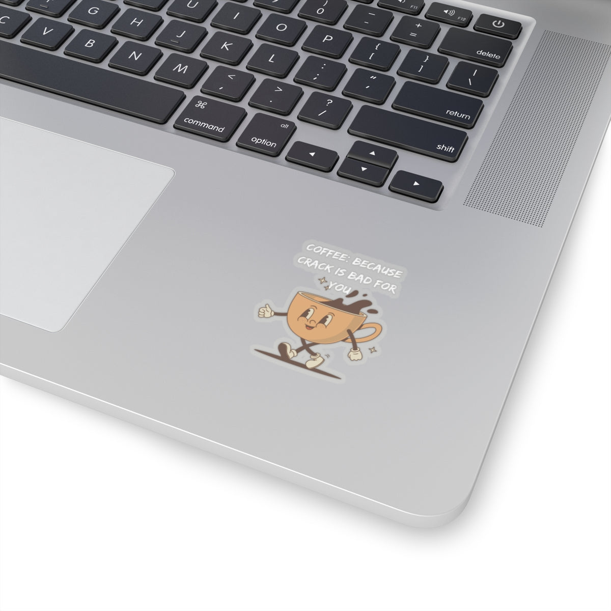 Humor kiss-cut sticker of a cheerful coffee cup with funny text on a silver laptop
