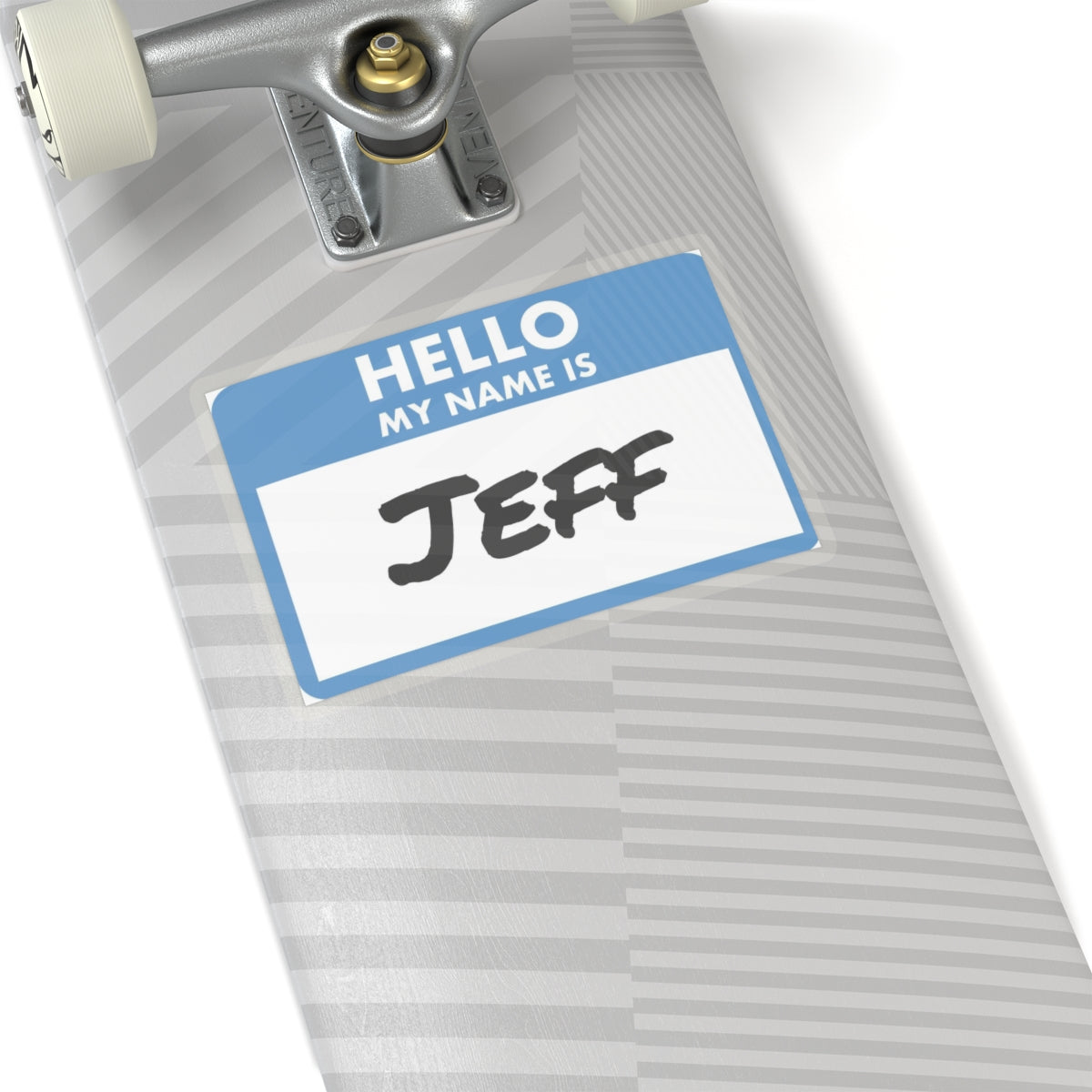 Printify my name is Jeff sticker with blue and white design placed on a gray skateboard deck