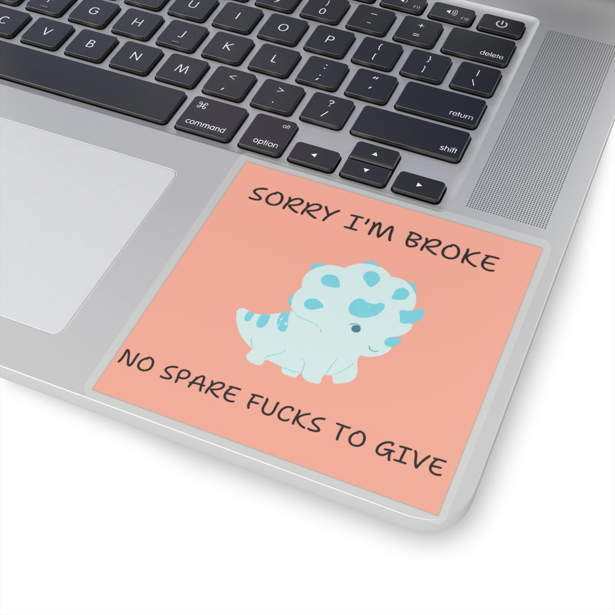 no fucks to give funny dino sticker with cartoon dinosaur and humorous text on laptop trackpad