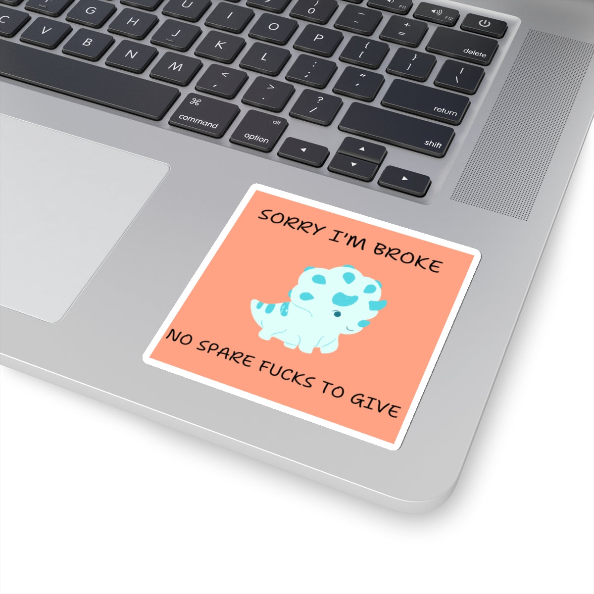 No fucks to give funny dino sticker with blue cartoon dinosaur and humorous text on laptop