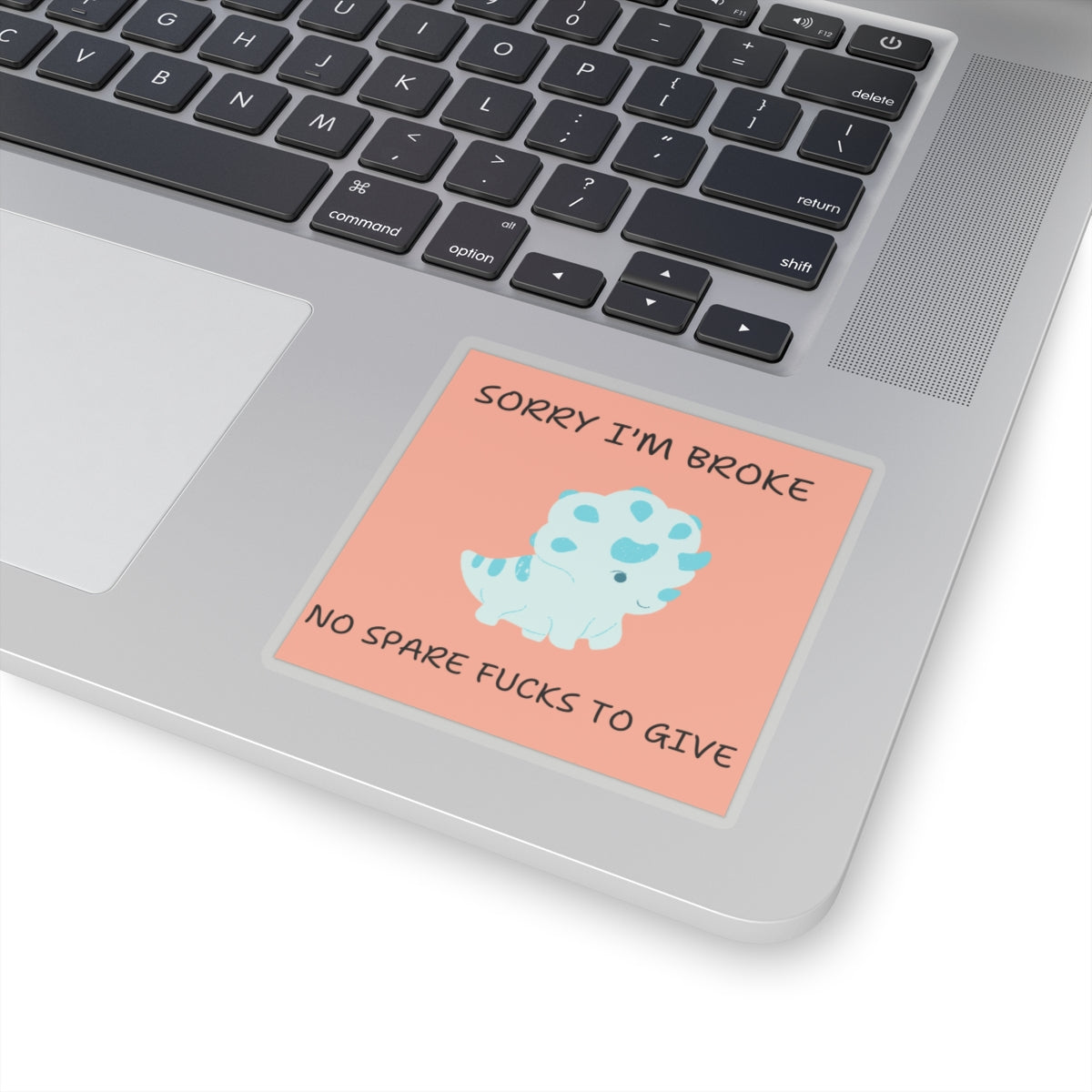 No fucks to give funny dino sticker with cute blue dinosaur and humorous text on laptop