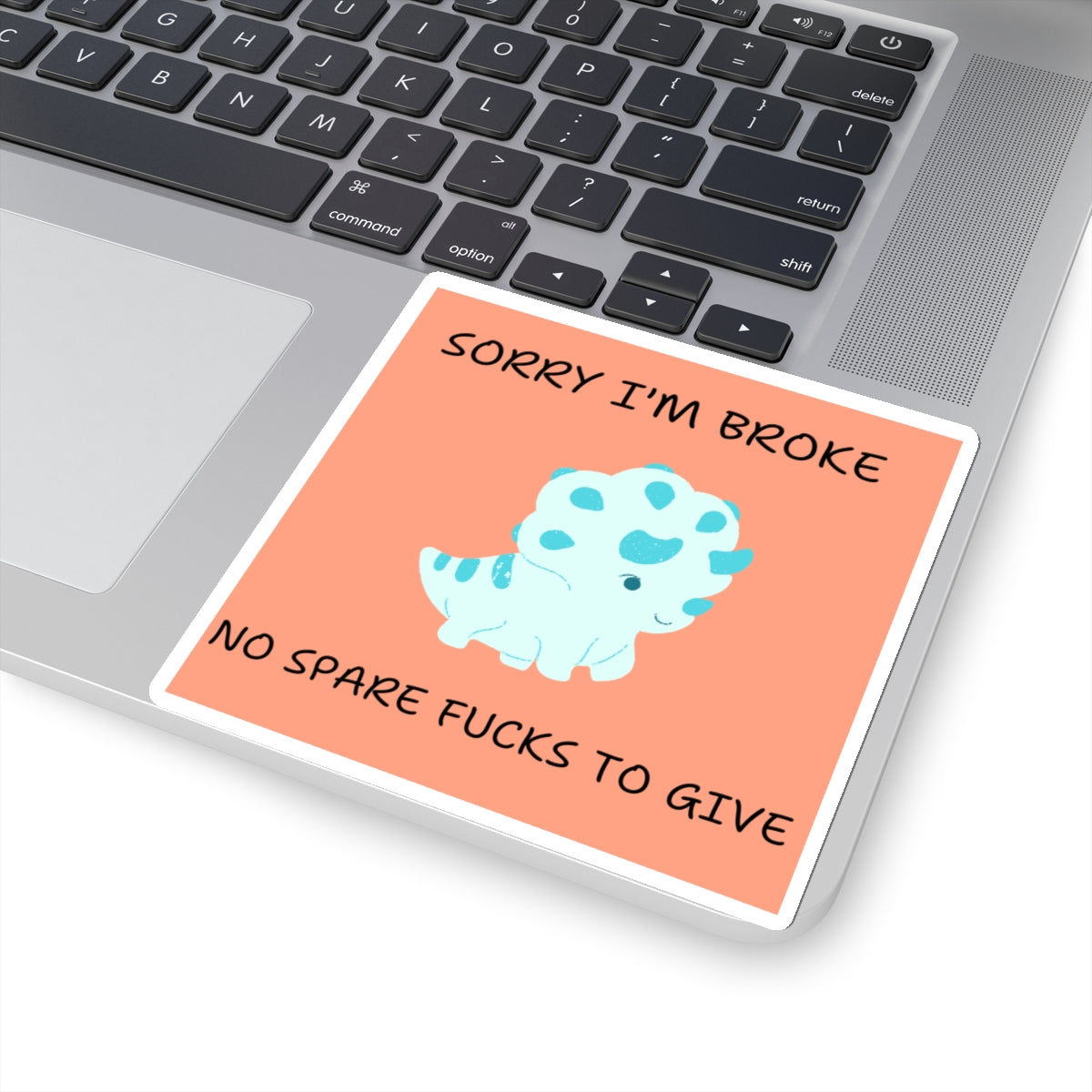 No fucks to give funny dino sticker with sad dinosaur and humorous text on laptop