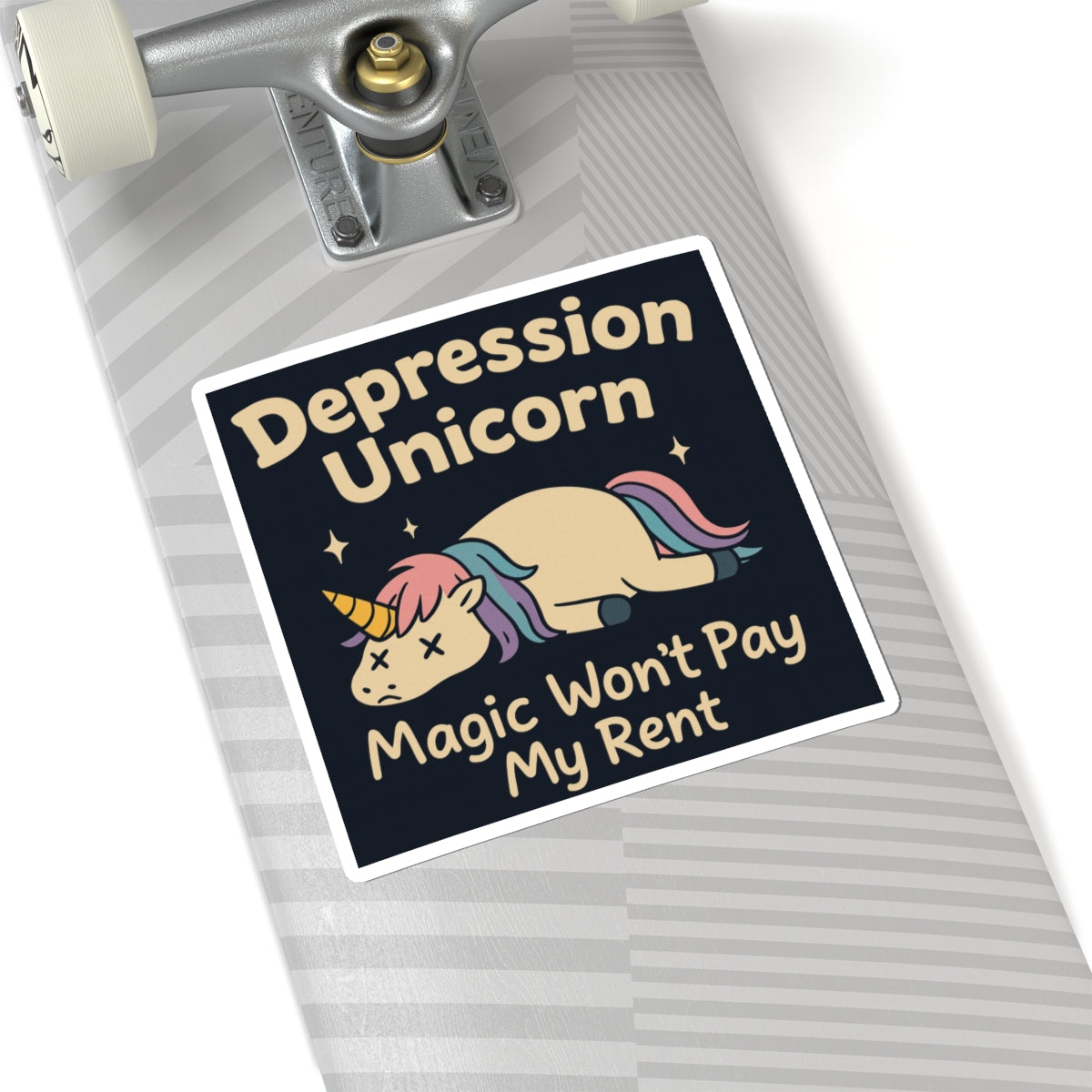 Funny cute unicorn art sticker on skateboard showing sad sleeping unicorn with text Magic Wont Pay My Rent