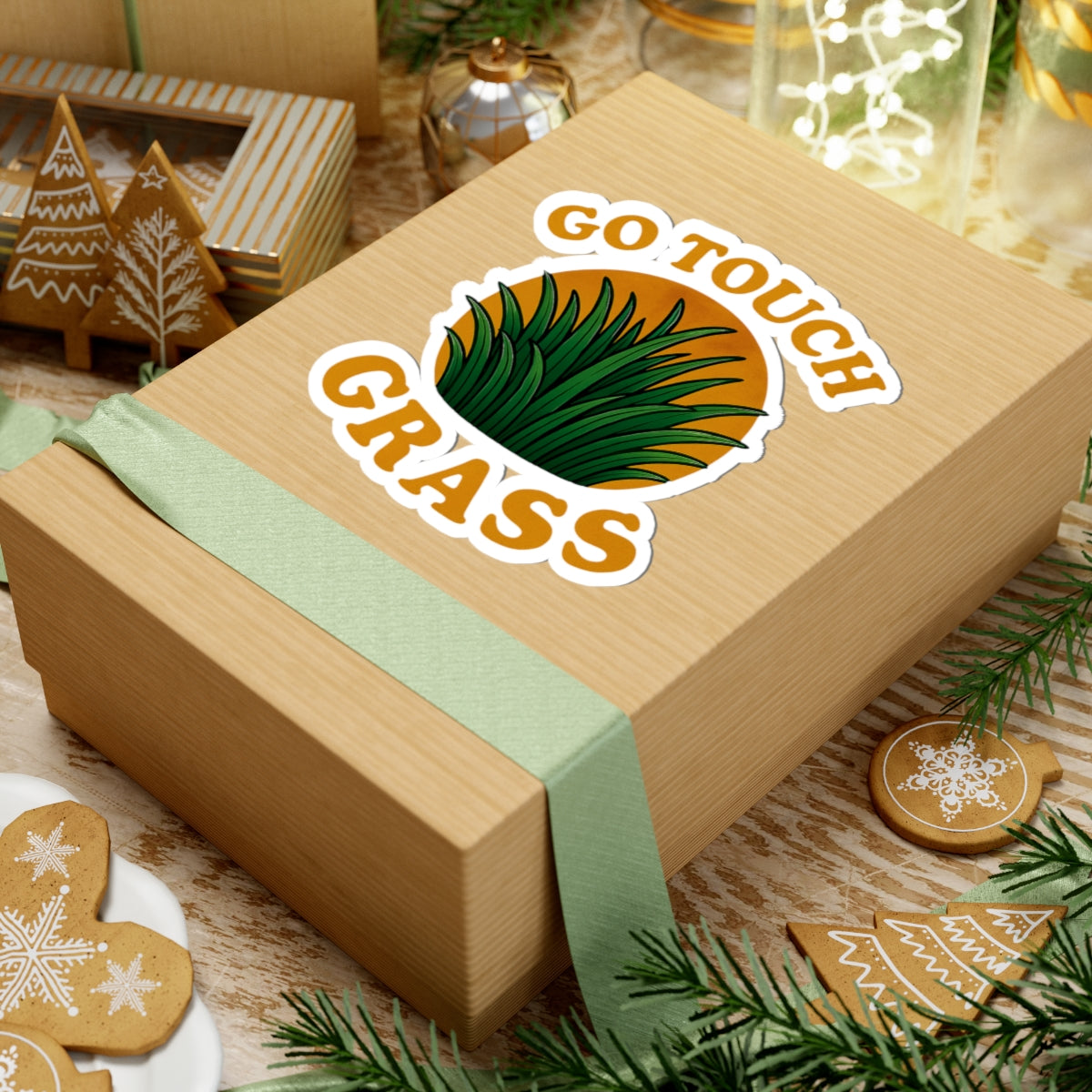 Printify paper sticker on wrapped gift box with green grass design and text GO TOUCH GRASS go touch grass funny meme kiss sticker