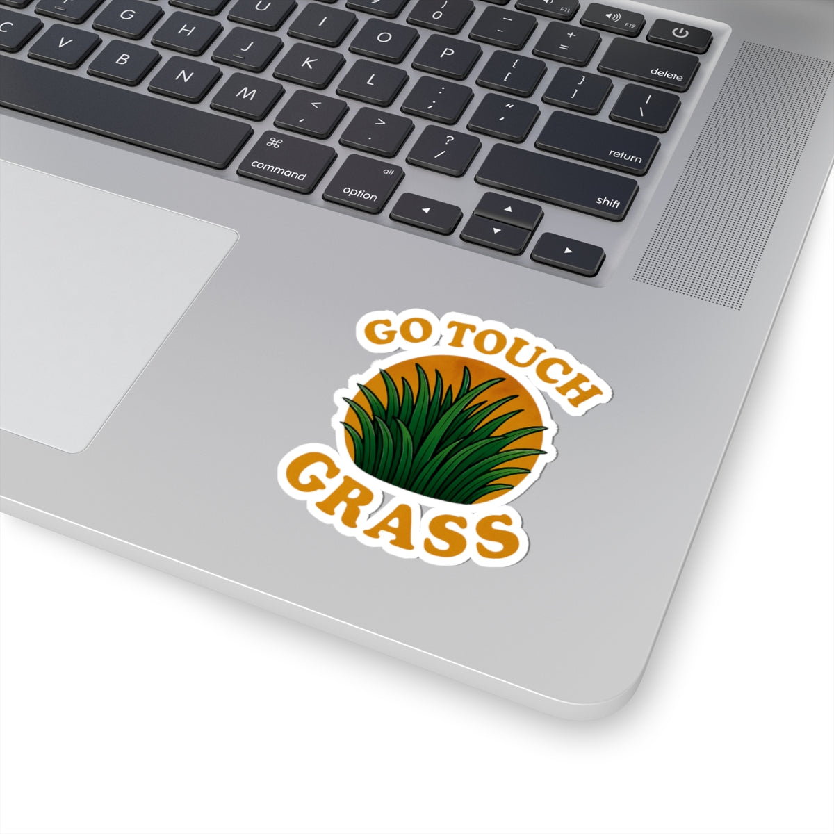 Printify paper sticker on laptop showing green grass emblem and GO TOUCH GRASS text go touch grass funny meme kiss sticker