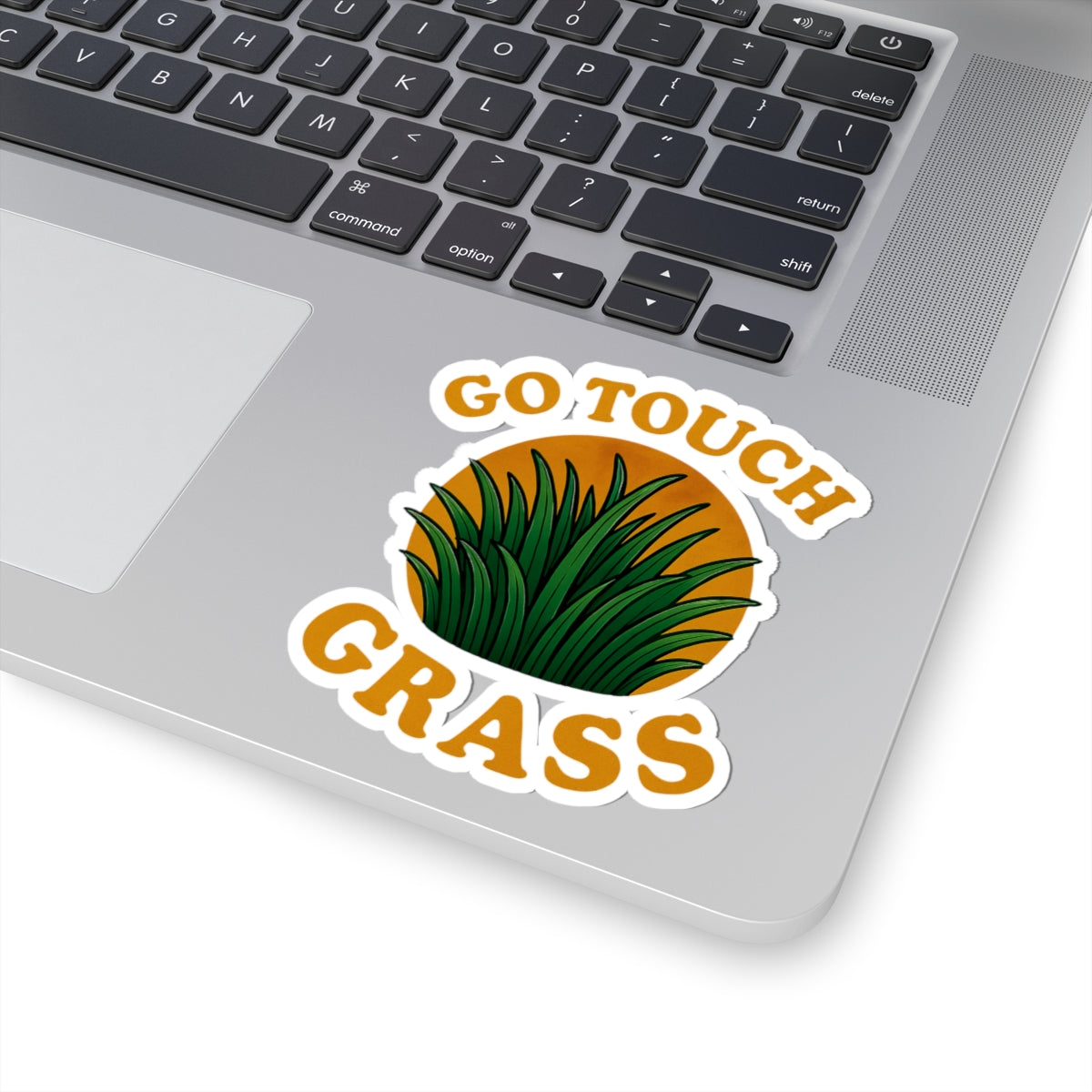 Printify paper sticker on laptop showing green grass art and Go Touch Grass text go touch grass funny meme kiss sticker