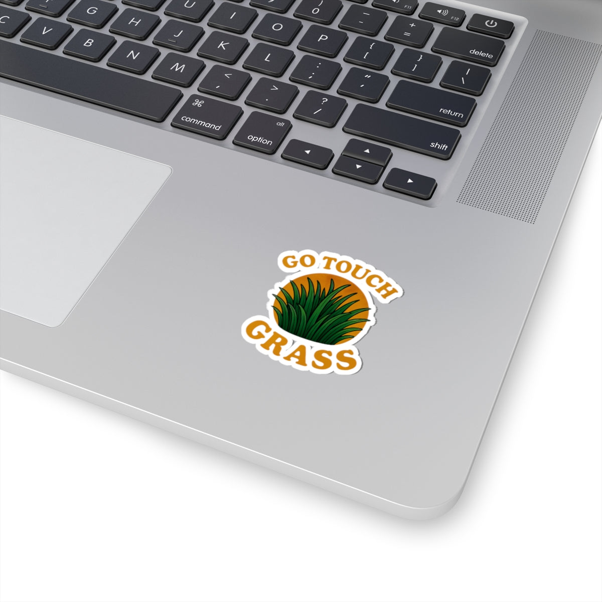 Printify paper sticker on laptop showing green grass and GO TOUCH GRASS text go touch grass funny meme kiss sticker