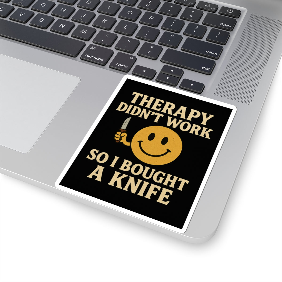 Therapy did not work so I bought a knife dark humor smiley sticker on a laptop for a quirky touch